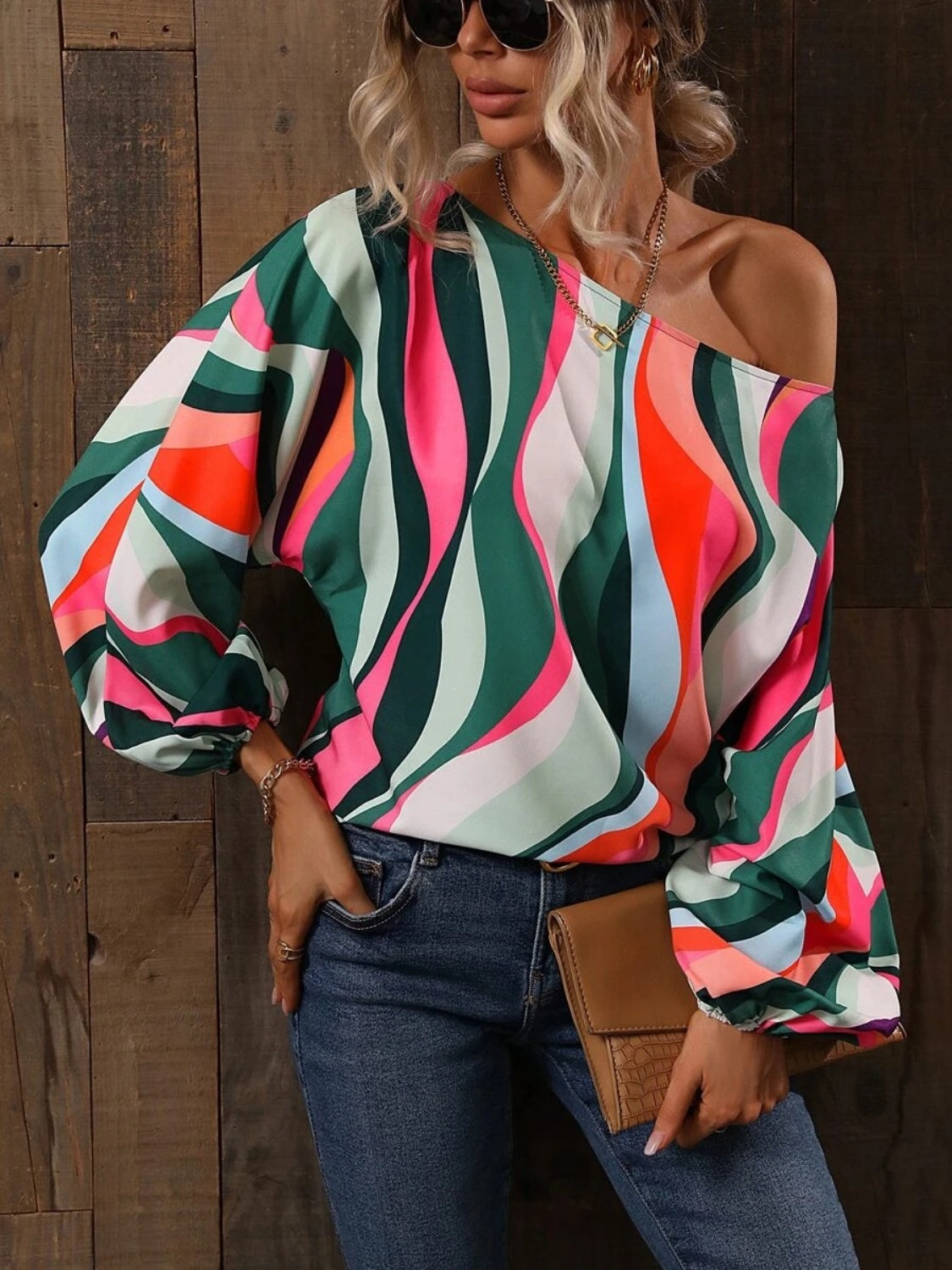 A stylish Printed Boat Neck Blouse in a vibrant print, showcasing its elegant boat neck design and lightweight fabric.