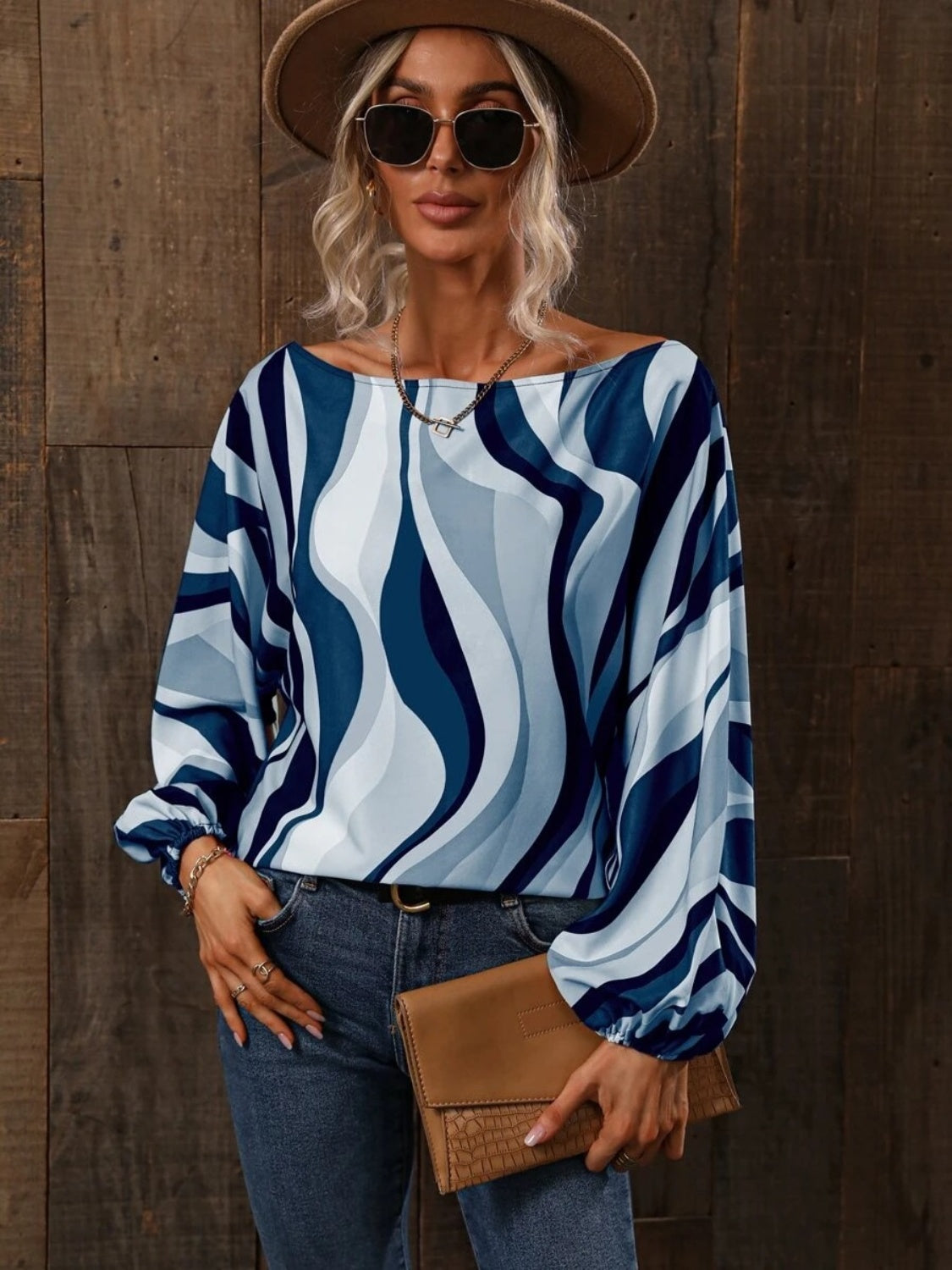 A stylish Printed Boat Neck Blouse in a vibrant print, showcasing its elegant boat neck design and lightweight fabric.