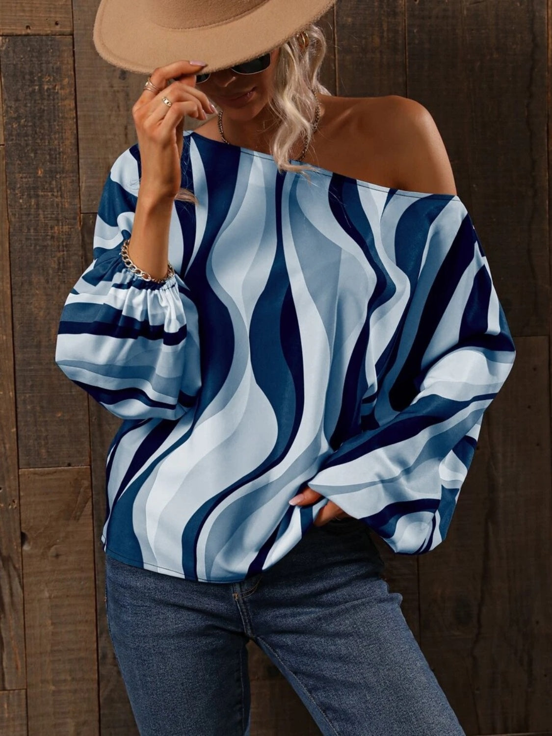 A stylish Printed Boat Neck Blouse in a vibrant print, showcasing its elegant boat neck design and lightweight fabric.