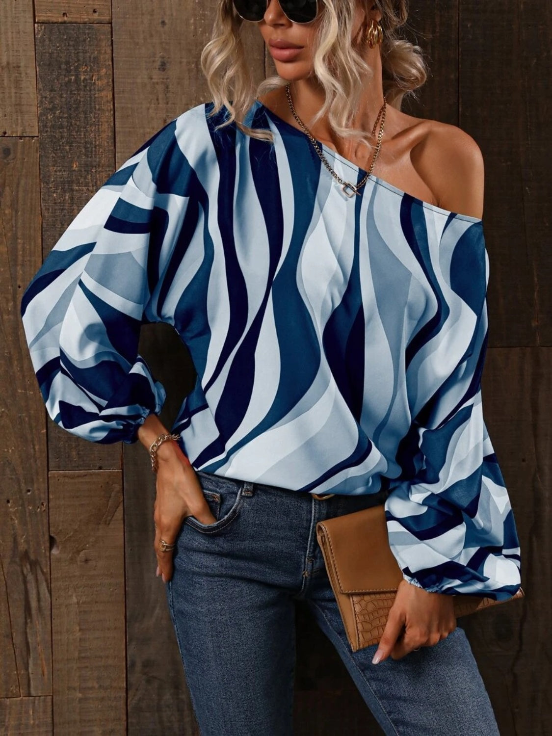 A stylish Printed Boat Neck Blouse in a vibrant print, showcasing its elegant boat neck design and lightweight fabric.