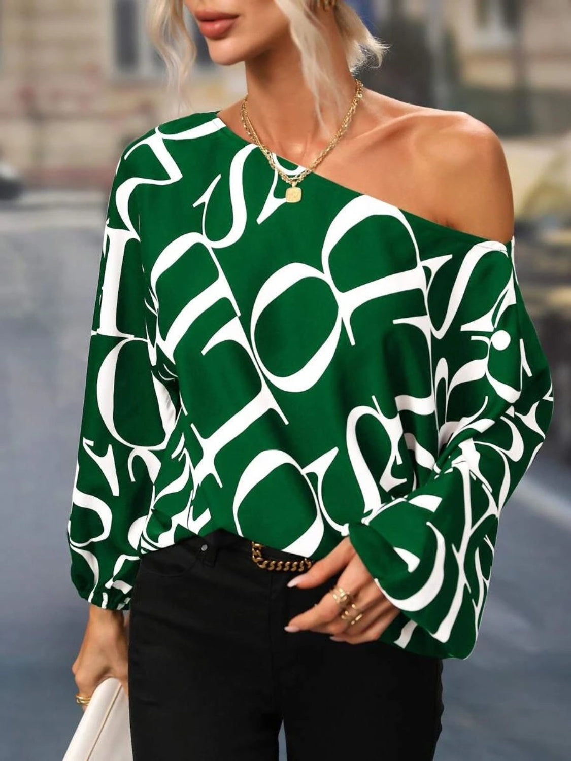 A stylish Printed Boat Neck Blouse in a vibrant print, showcasing its elegant boat neck design and lightweight fabric.