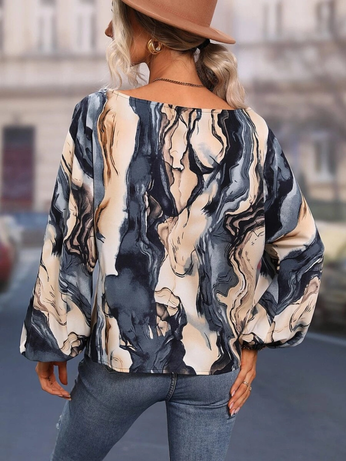 A stylish Printed Boat Neck Blouse in a vibrant print, showcasing its elegant boat neck design and lightweight fabric.