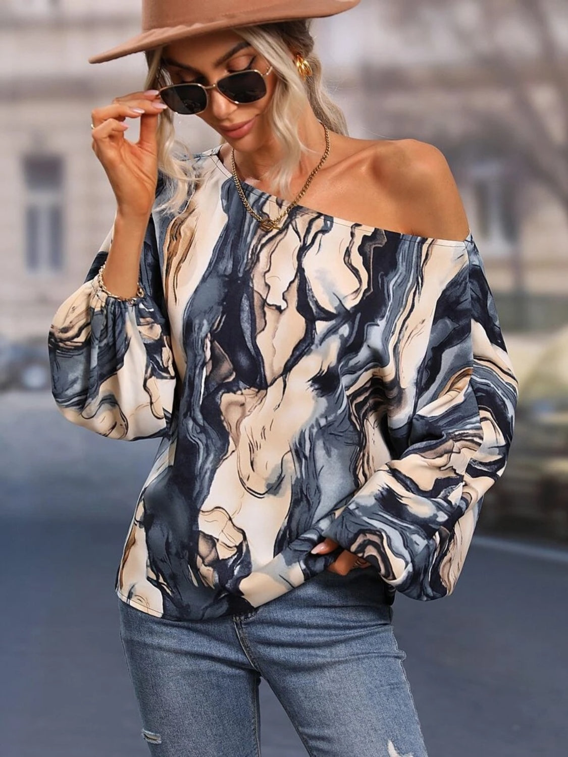 A stylish Printed Boat Neck Blouse in a vibrant print, showcasing its elegant boat neck design and lightweight fabric.