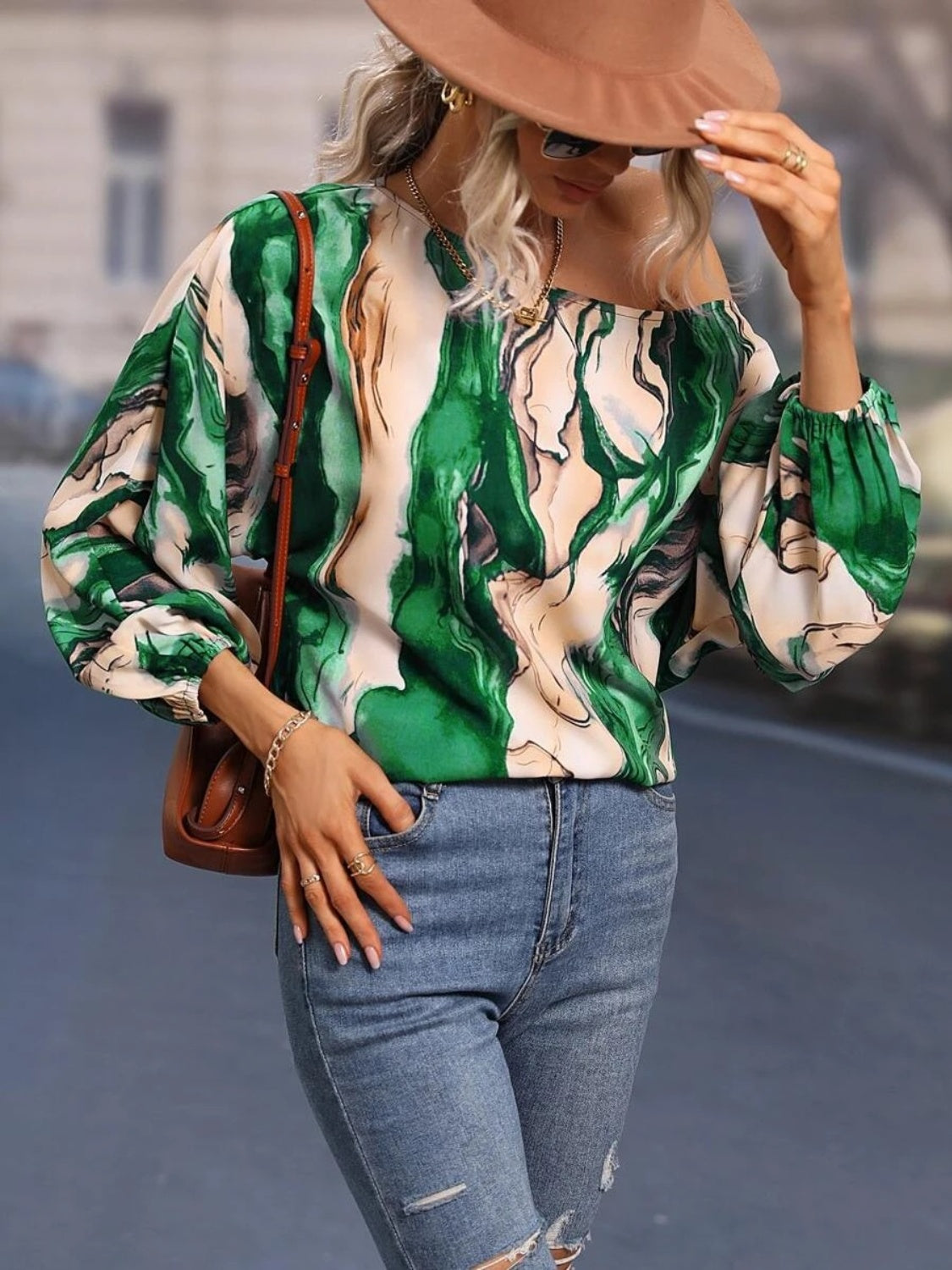 A stylish Printed Boat Neck Blouse in a vibrant print, showcasing its elegant boat neck design and lightweight fabric.