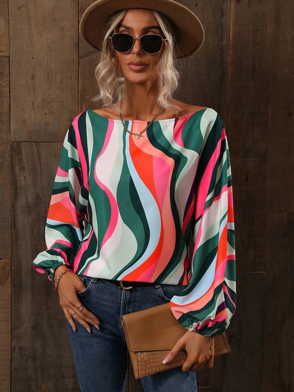 A stylish Printed Boat Neck Blouse in a vibrant print, showcasing its elegant boat neck design and lightweight fabric.