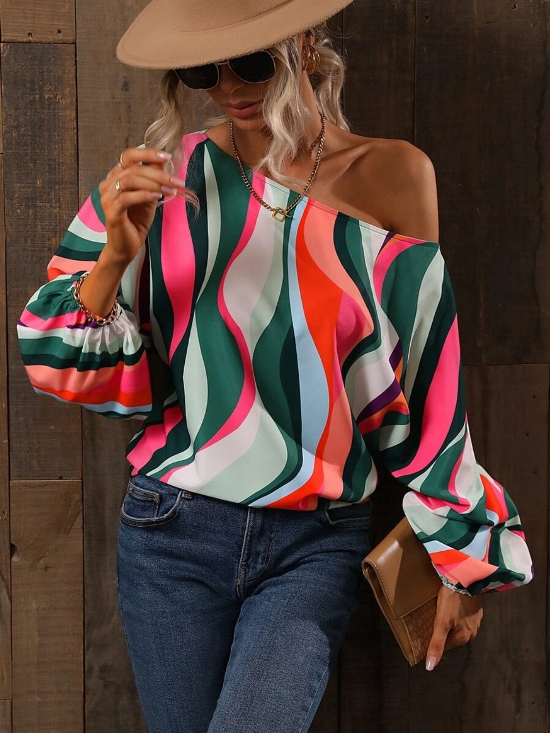 A stylish Printed Boat Neck Blouse in a vibrant print, showcasing its elegant boat neck design and lightweight fabric.