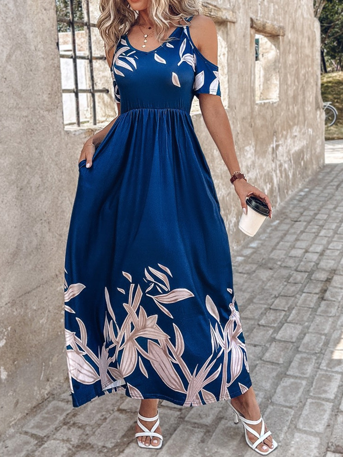 A stylish Printed Cold Shoulder Short Sleeve Maxi Dress featuring a trendy design, side pockets, and a lightweight fabric, perfect for summer wear.