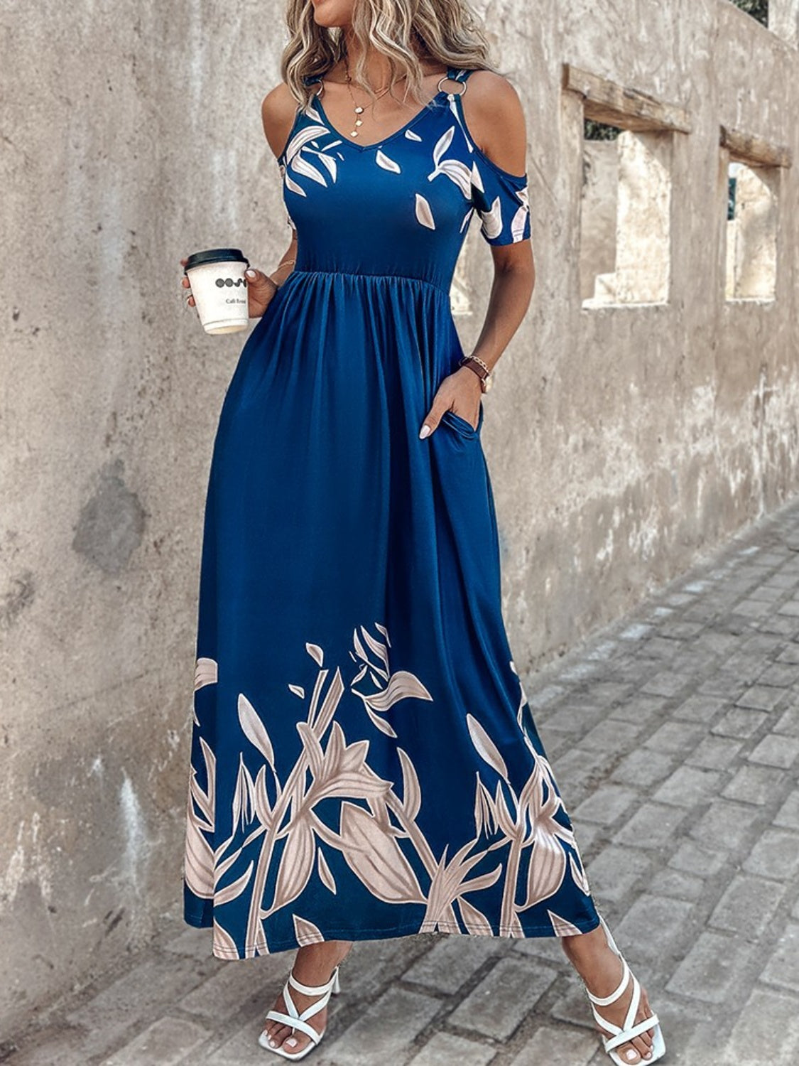 A stylish Printed Cold Shoulder Short Sleeve Maxi Dress featuring a trendy design, side pockets, and a lightweight fabric, perfect for summer wear.