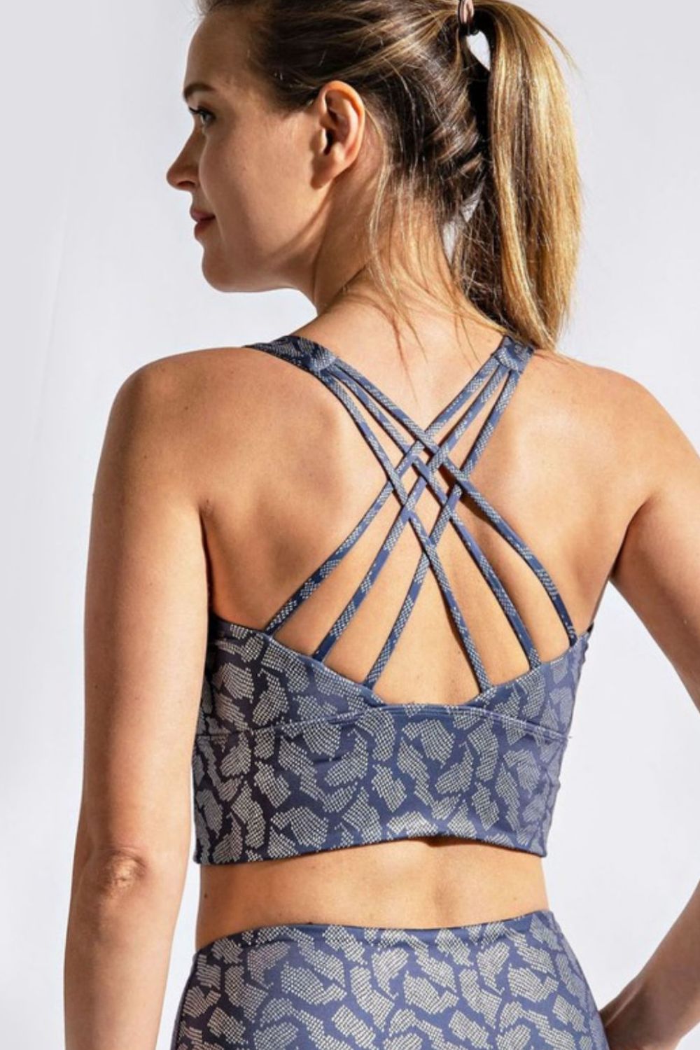 Printed Crisscross Back Sports Bra showcasing its stylish design and comfortable fabric, ideal for fitness activities.