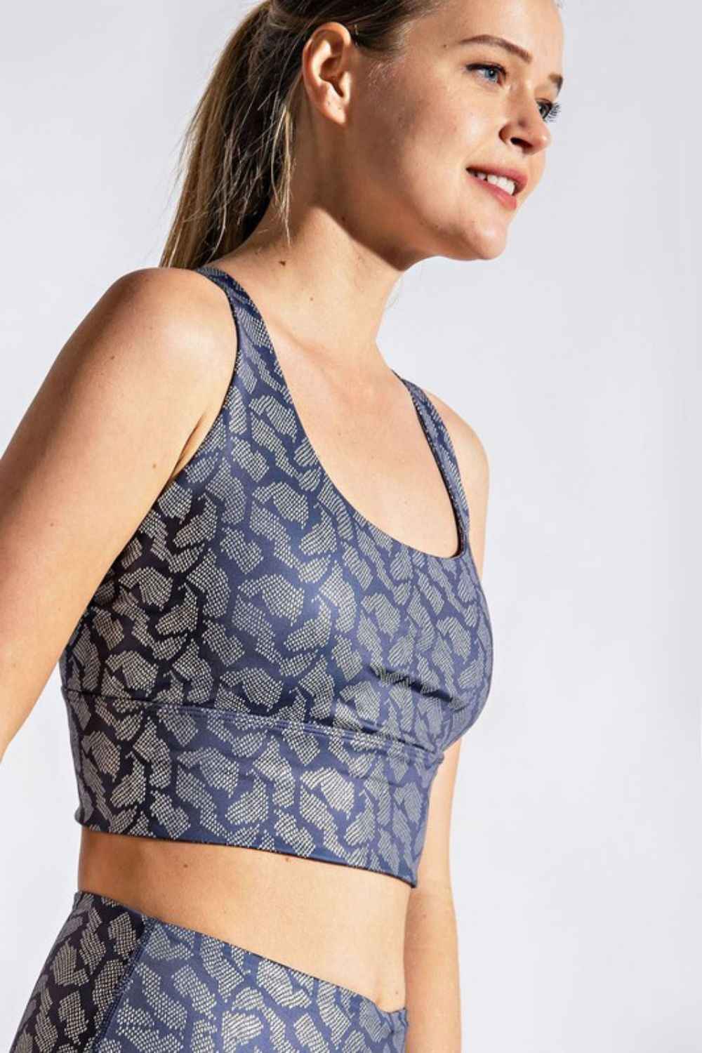 Printed Crisscross Back Sports Bra showcasing its stylish design and comfortable fabric, ideal for fitness activities.