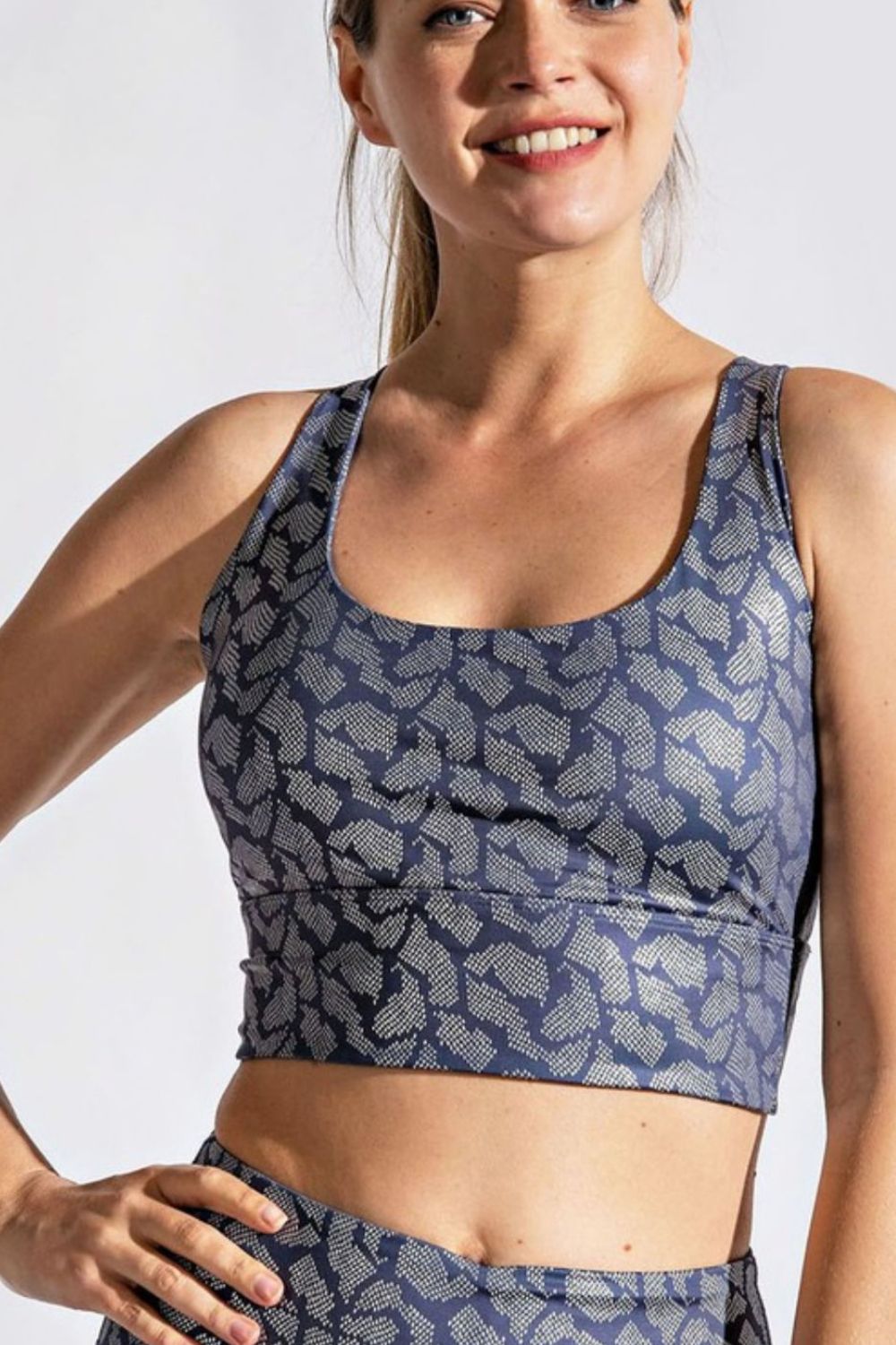 Printed Crisscross Back Sports Bra showcasing its stylish design and comfortable fabric, ideal for fitness activities.