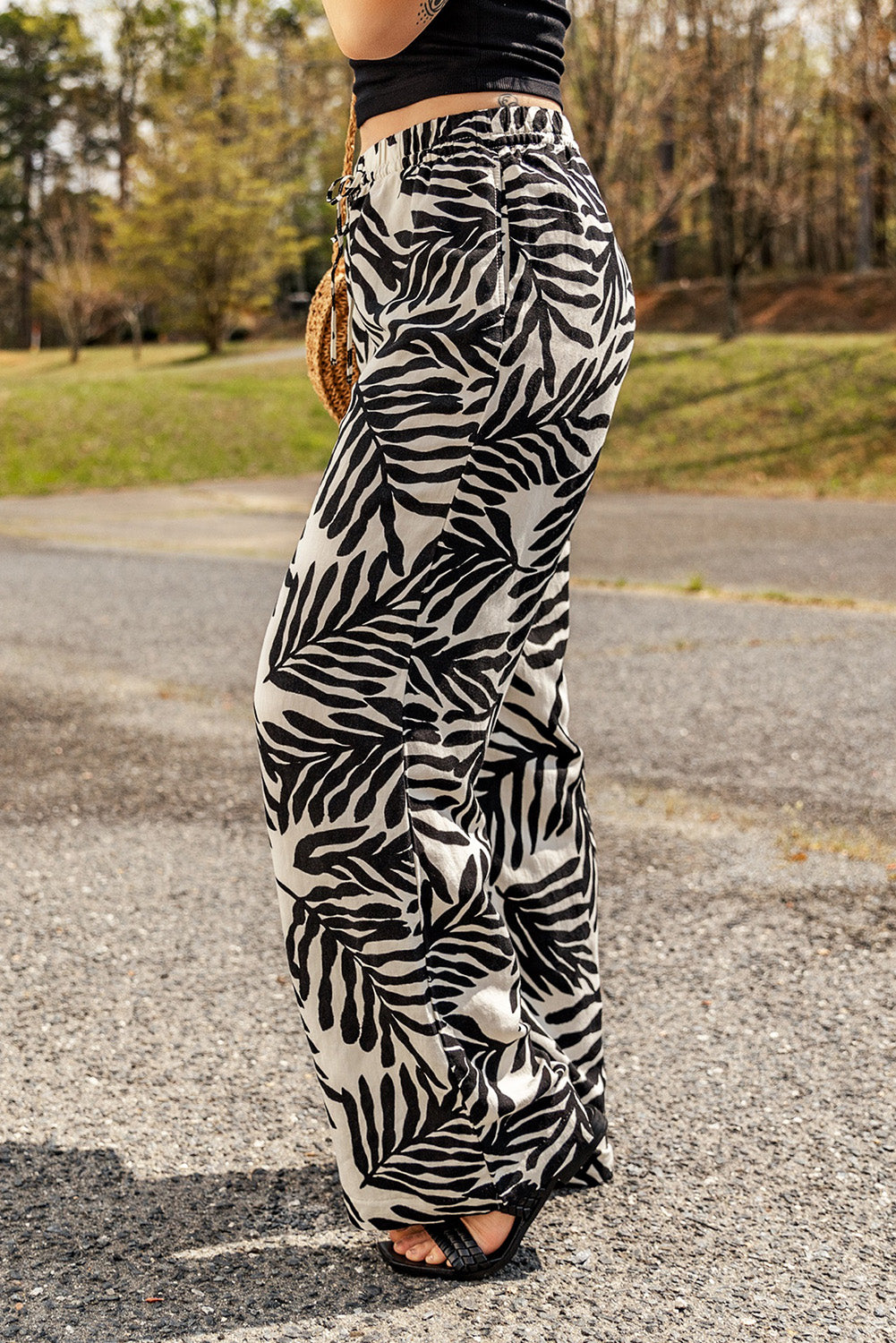 A pair of stylish printed drawstring waist pants with pockets, showcasing a vibrant pattern and comfortable fit.