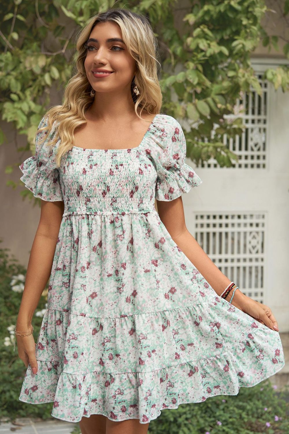 A stylish Printed Flounce Sleeve Smocked Dress featuring a floral pattern, square neckline, and puff sleeves, perfect for casual outings.