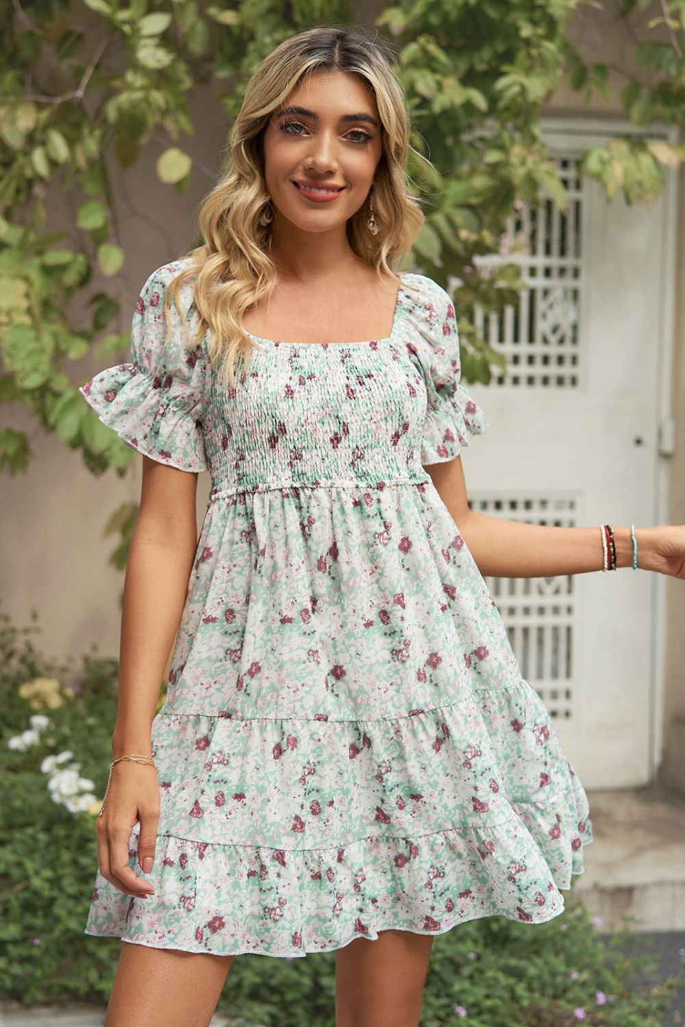 A stylish Printed Flounce Sleeve Smocked Dress featuring a floral pattern, square neckline, and puff sleeves, perfect for casual outings.