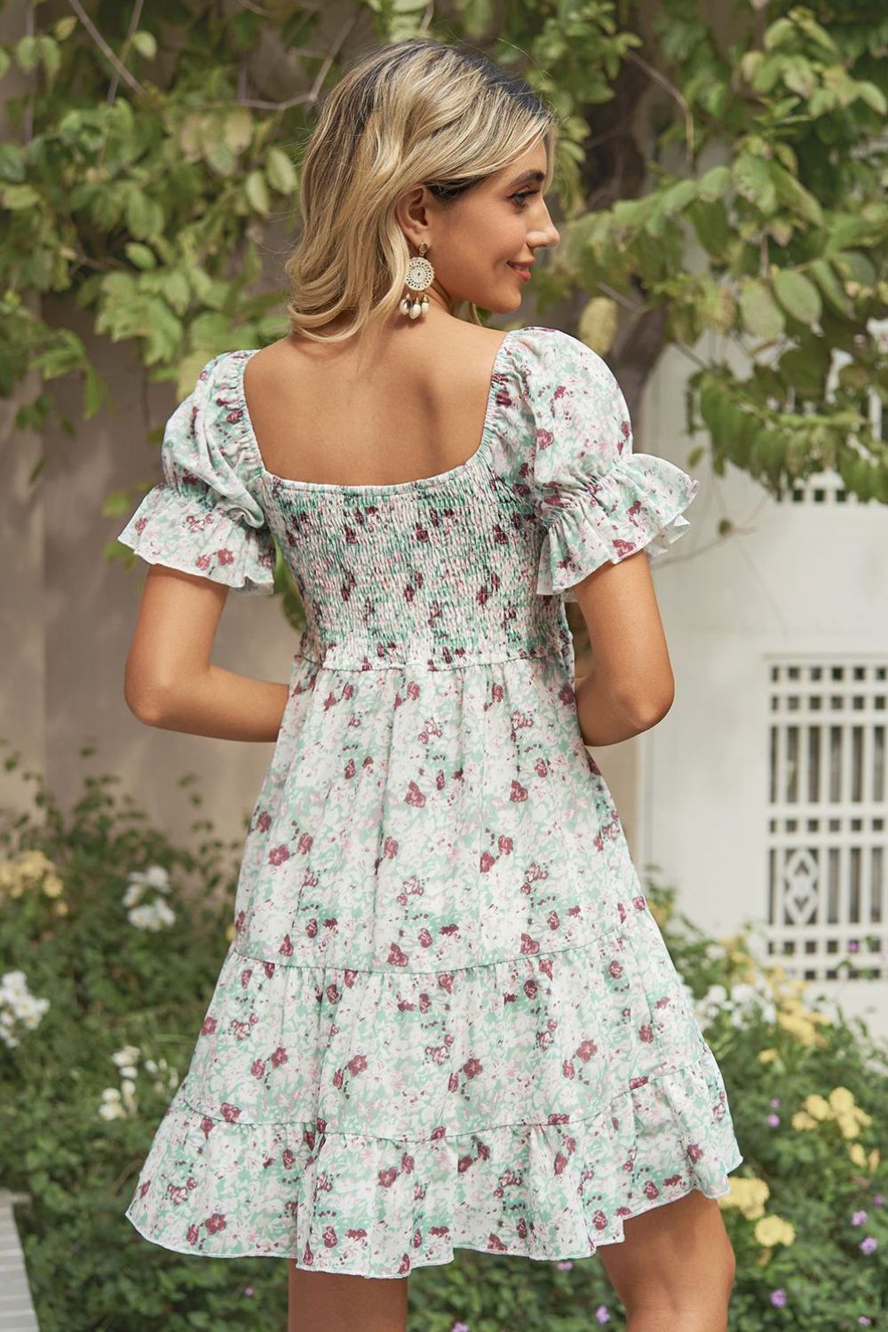 A stylish Printed Flounce Sleeve Smocked Dress featuring a floral pattern, square neckline, and puff sleeves, perfect for casual outings.