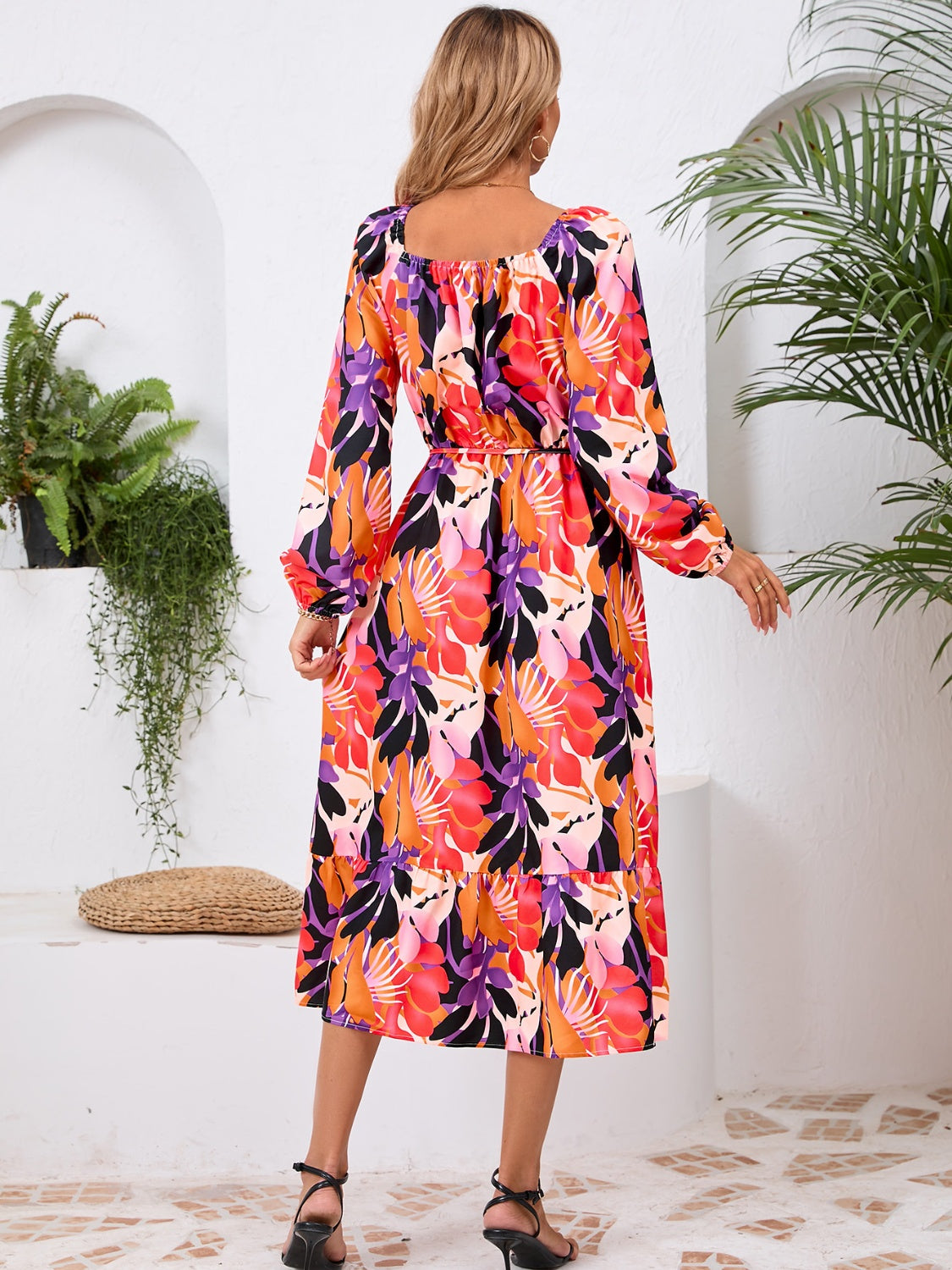 A stylish Printed Long Sleeve Midi Dress featuring a tied design, long sleeves, and a vibrant print, perfect for various occasions.