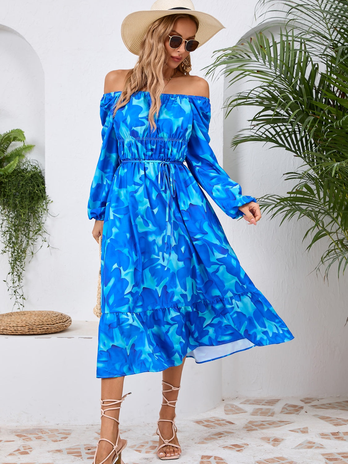 A stylish Printed Long Sleeve Midi Dress featuring a tied design, long sleeves, and a vibrant print, perfect for various occasions.