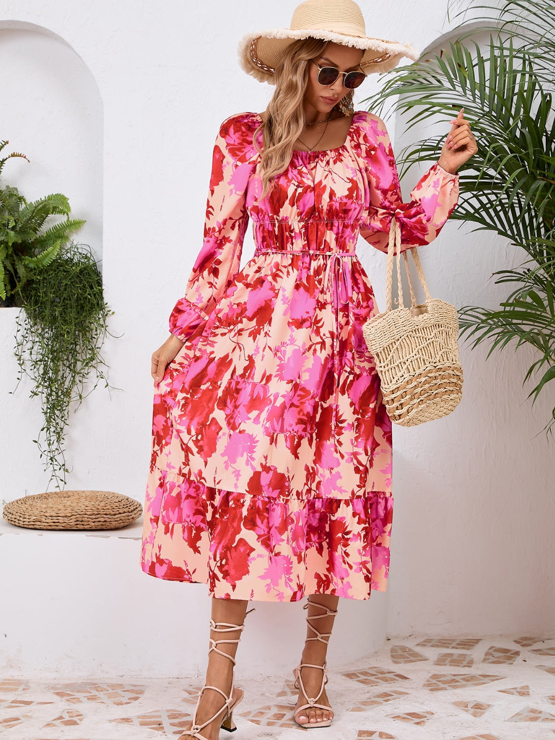 A stylish Printed Long Sleeve Midi Dress featuring a tied design, long sleeves, and a vibrant print, perfect for various occasions.