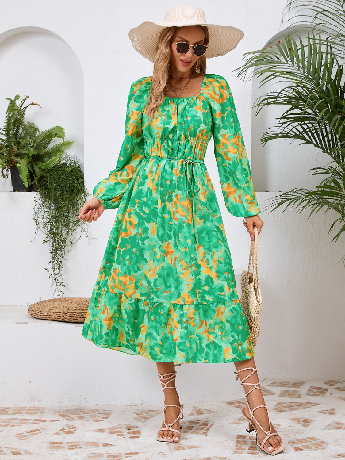 A stylish Printed Long Sleeve Midi Dress featuring a tied design, long sleeves, and a vibrant print, perfect for various occasions.