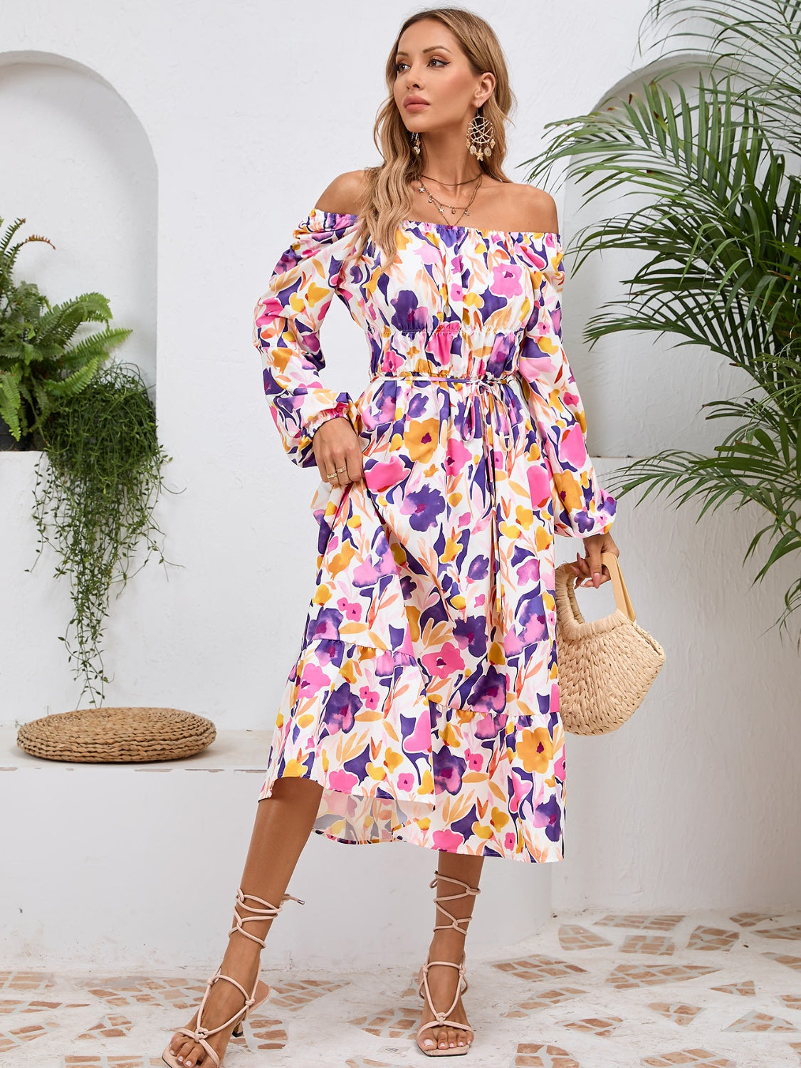 A stylish Printed Long Sleeve Midi Dress featuring a tied design, long sleeves, and a vibrant print, perfect for various occasions.