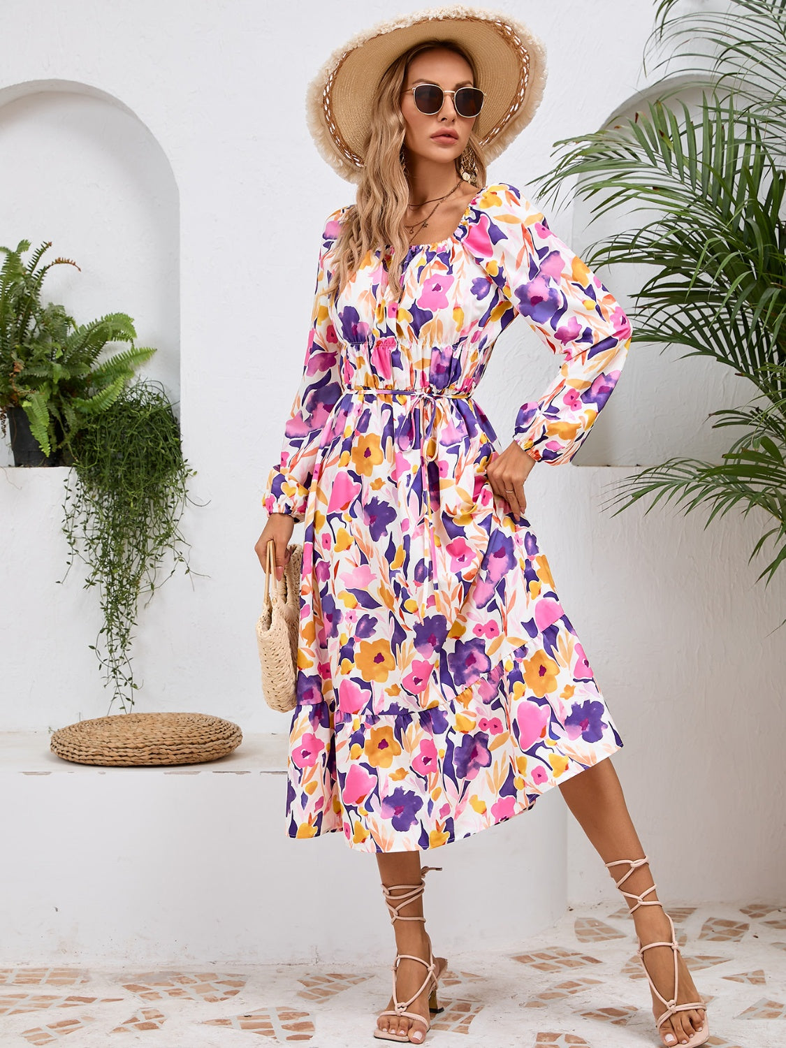 A stylish Printed Long Sleeve Midi Dress featuring a tied design, long sleeves, and a vibrant print, perfect for various occasions.