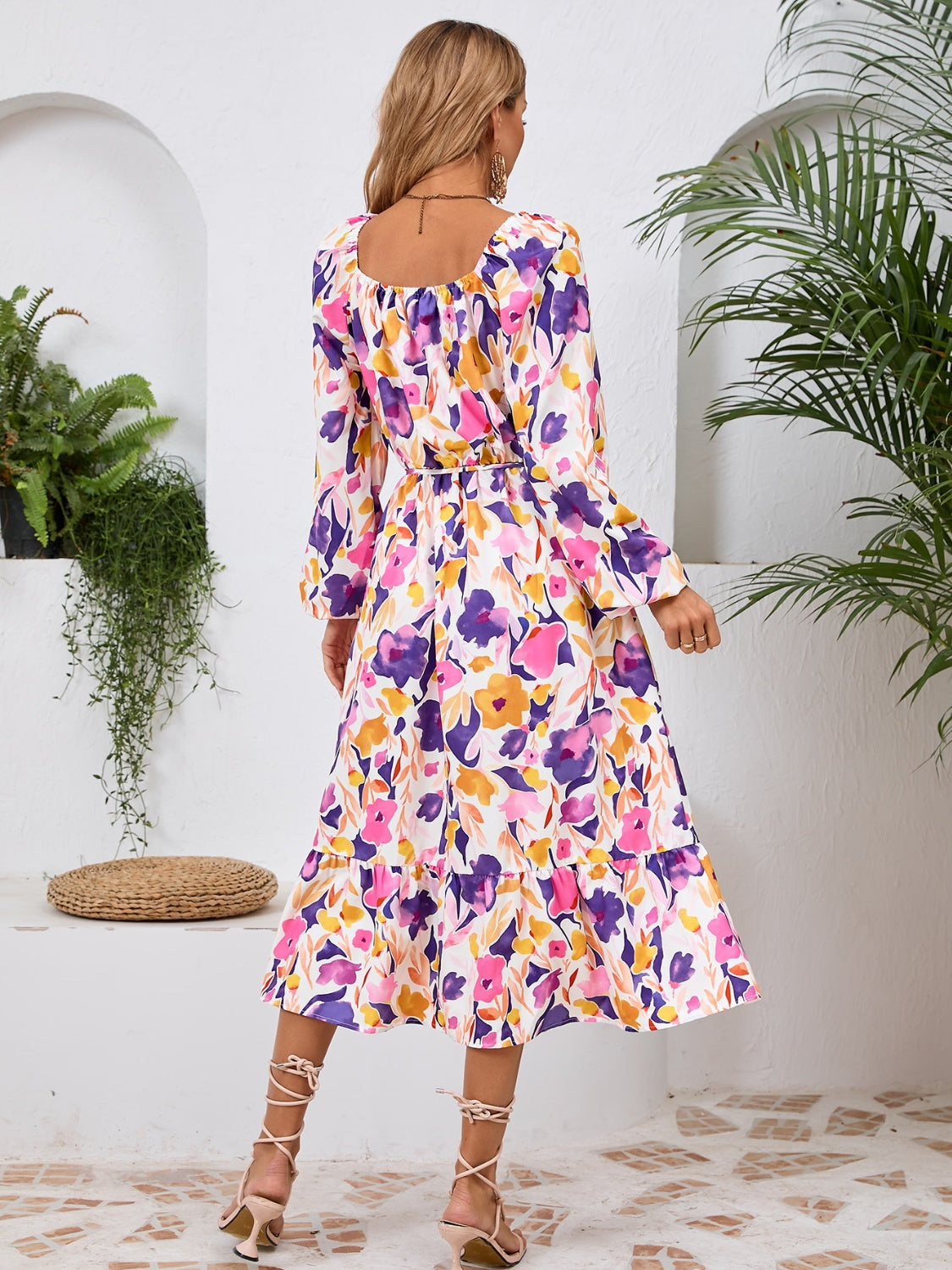 A stylish Printed Long Sleeve Midi Dress featuring a tied design, long sleeves, and a vibrant print, perfect for various occasions.