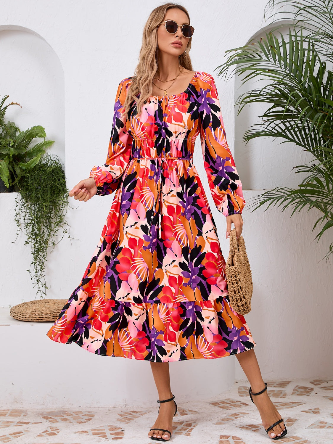 A stylish Printed Long Sleeve Midi Dress featuring a tied design, long sleeves, and a vibrant print, perfect for various occasions.