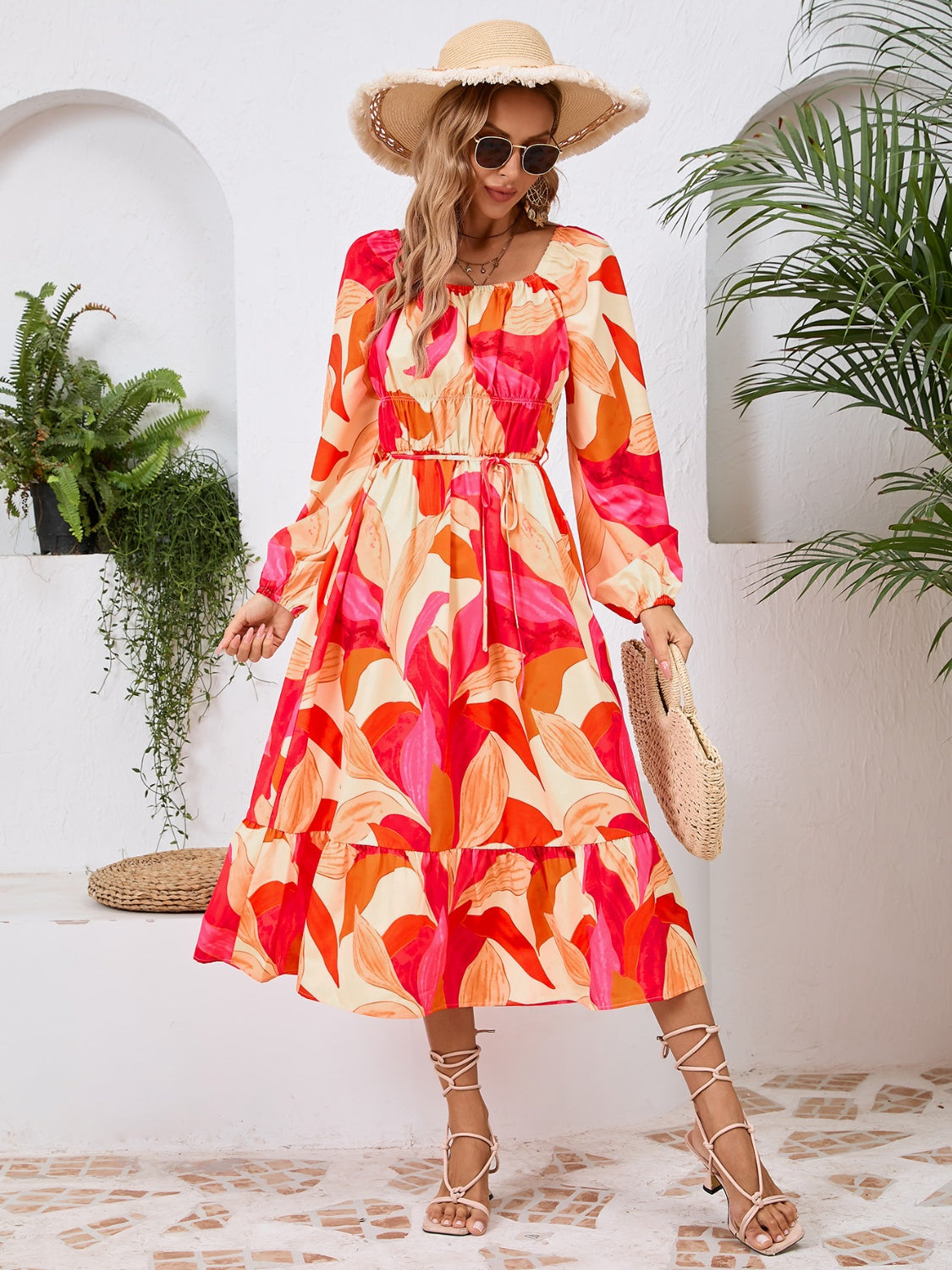 A stylish Printed Long Sleeve Midi Dress featuring a tied design, long sleeves, and a vibrant print, perfect for various occasions.