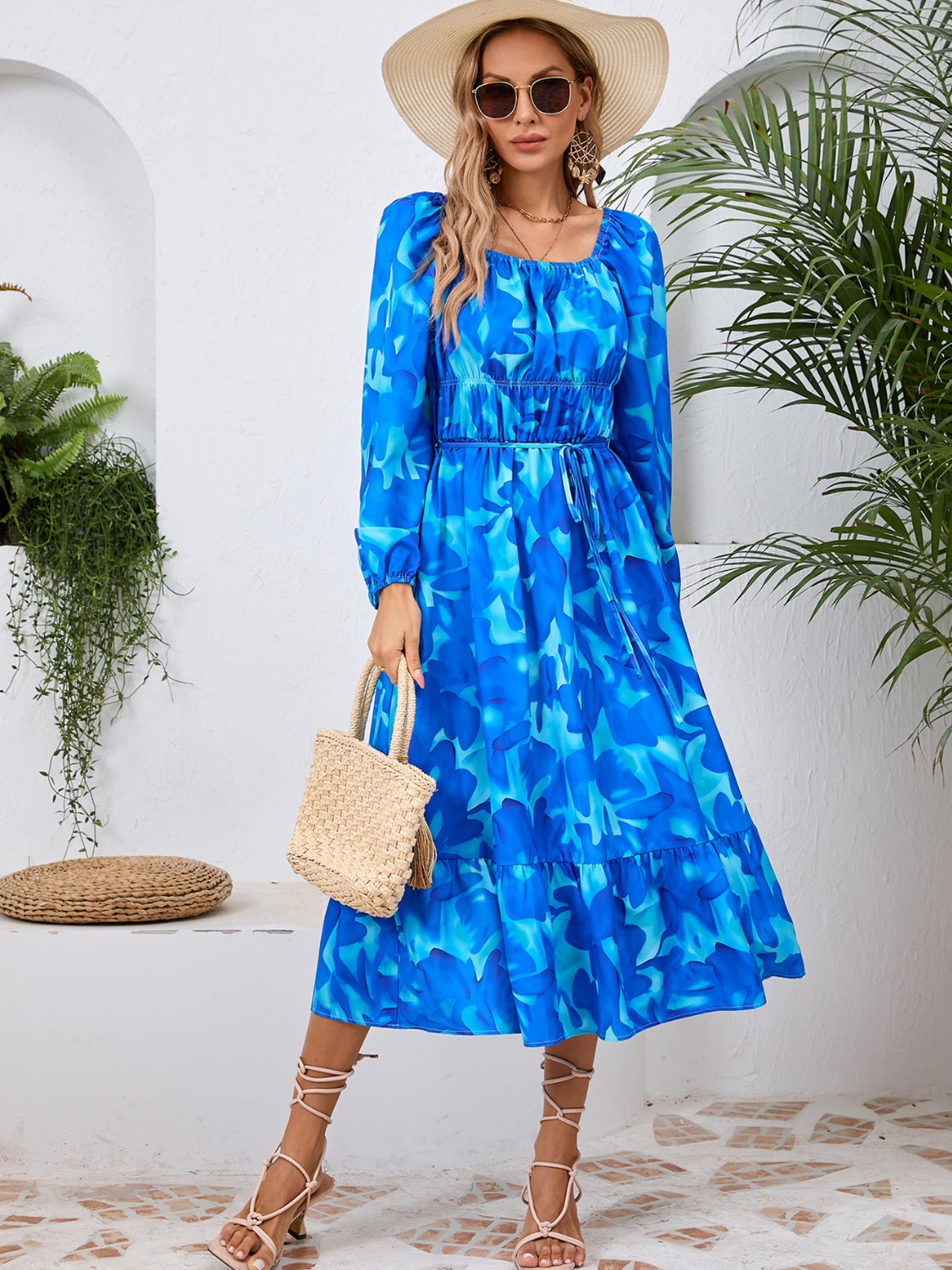 A stylish Printed Long Sleeve Midi Dress featuring a tied design, long sleeves, and a vibrant print, perfect for various occasions.