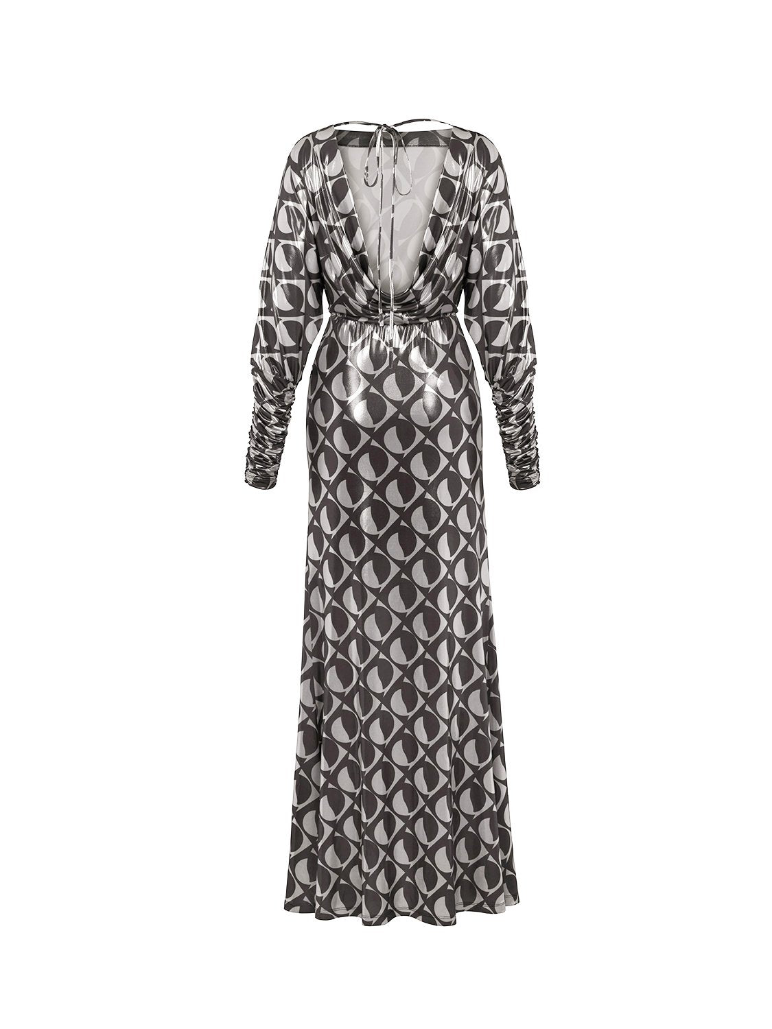 A stylish Printed Open Back Dress featuring a boat neck, long batwing sleeves, and a flowy back with a tie closure, showcasing a chic monochrome pattern.