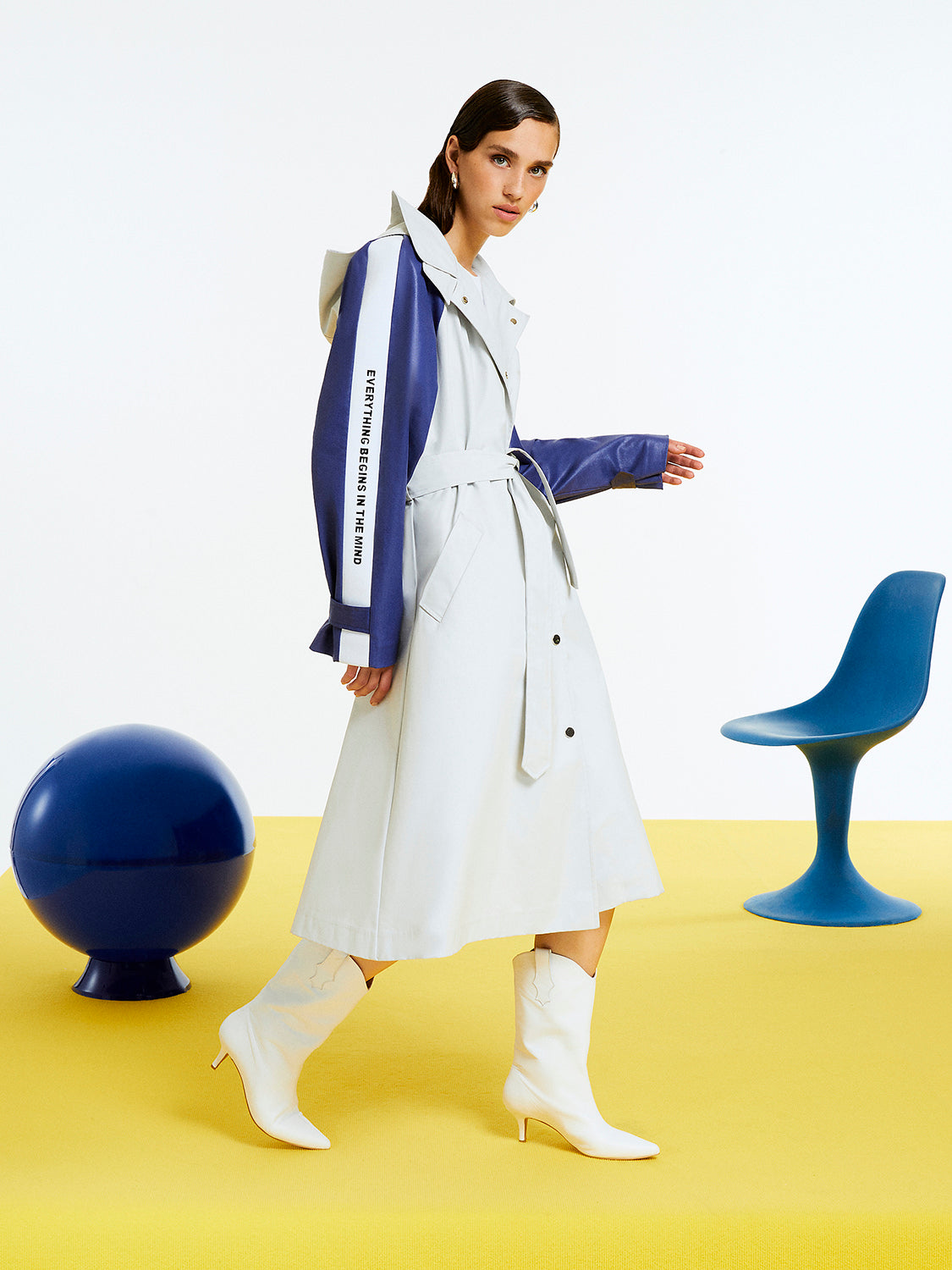 A stylish Printed Oversized Trench coat featuring a self-belt, hood, and epaulettes, designed for comfort and fashion.