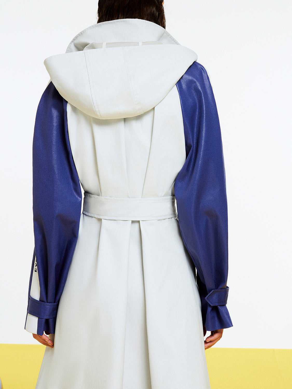 A stylish Printed Oversized Trench coat featuring a self-belt, hood, and epaulettes, designed for comfort and fashion.