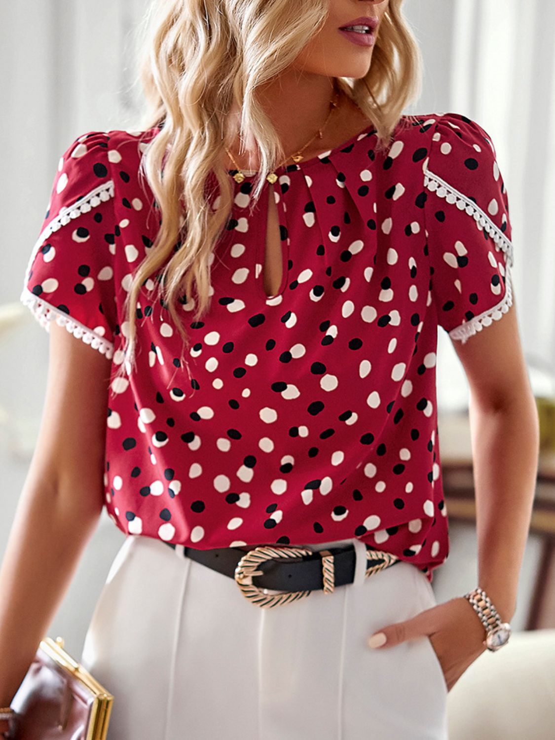 A stylish Printed Petal Sleeve Round Neck Blouse featuring a chic printed design, puff short sleeves, and a round neckline, perfect for casual wear.