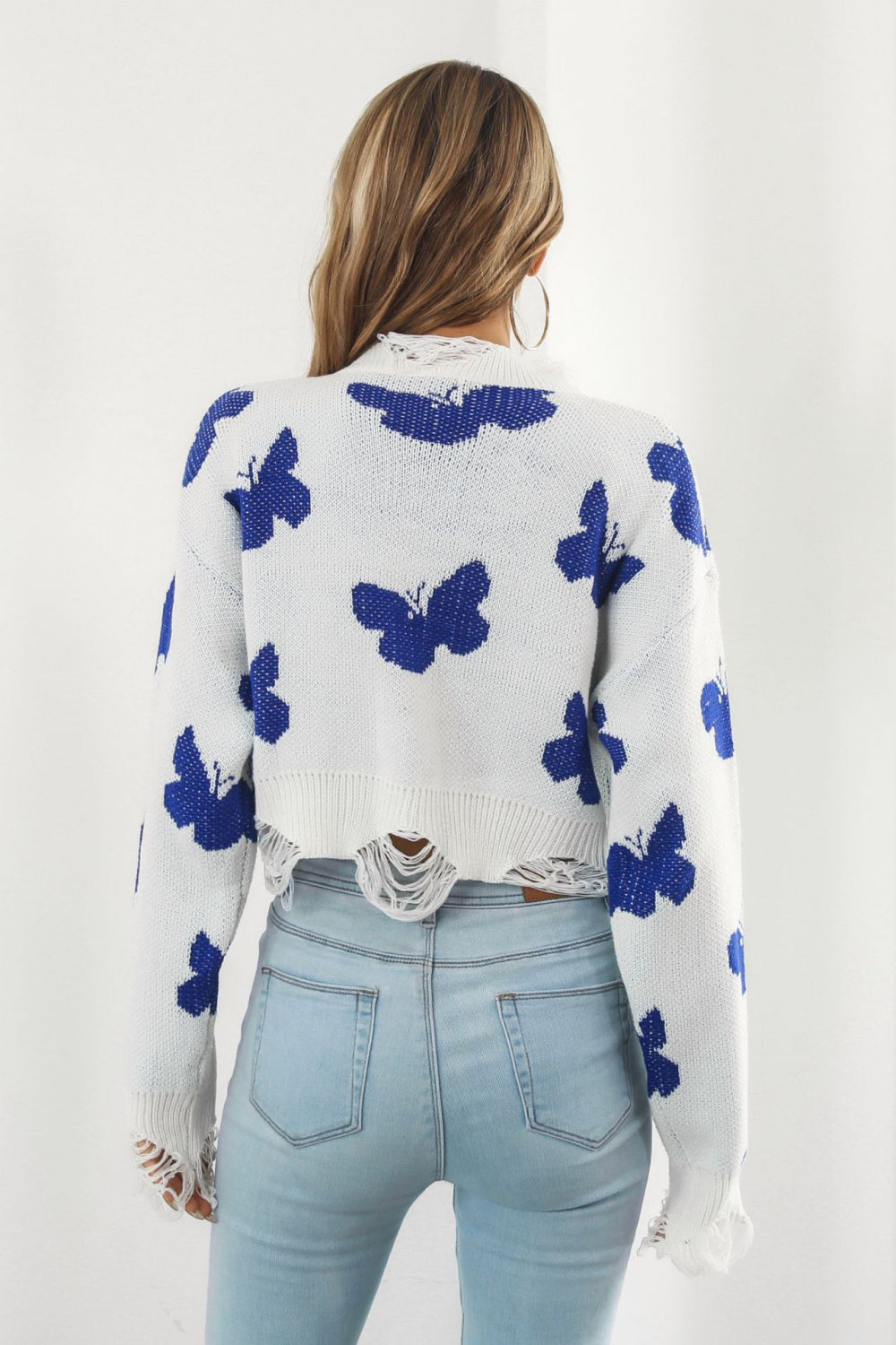 A stylish Printed Round Neck Ribbed Long Sleeve Sweater featuring a unique pattern, cropped length, and long sleeves, made from soft acrylic material.