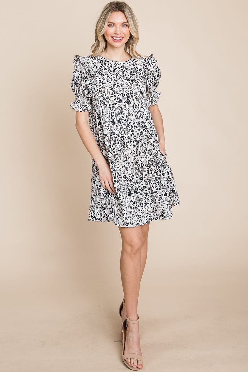 A stylish Printed Ruffle Short Sleeve Tiered Swing Dress featuring layered design, short puff sleeves, and vibrant abstract print with side pockets.