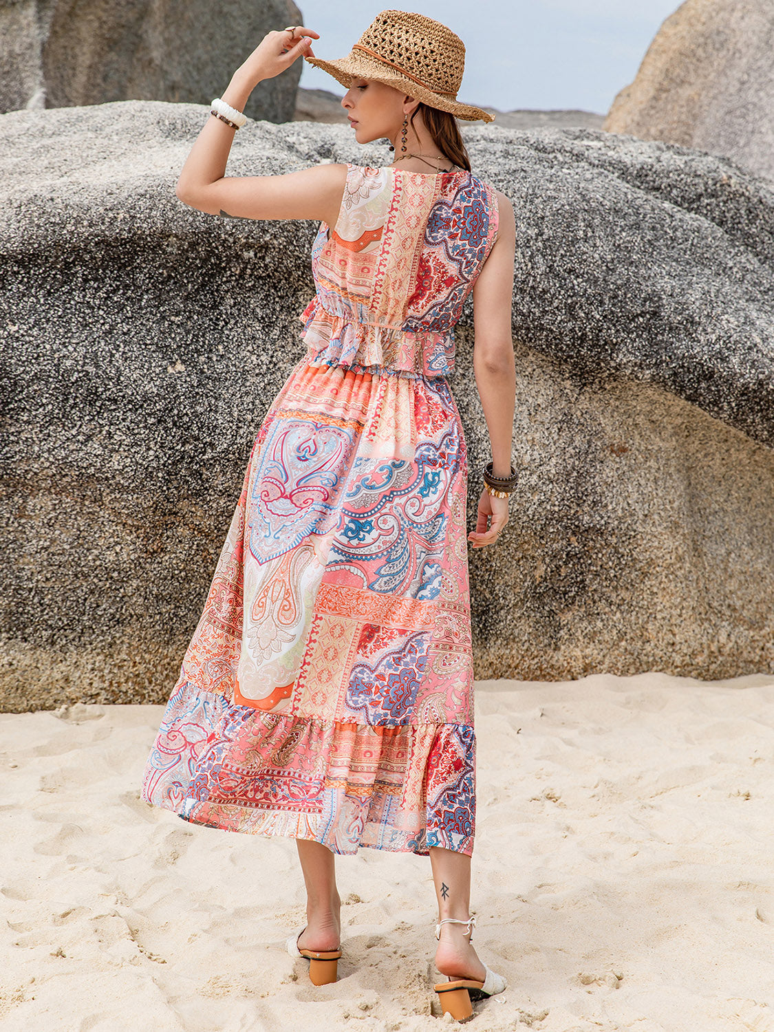 A stylish Printed V-Neck Top and Midi Skirt Set featuring a ruffled design, made from 100% viscose, displayed on a mannequin.