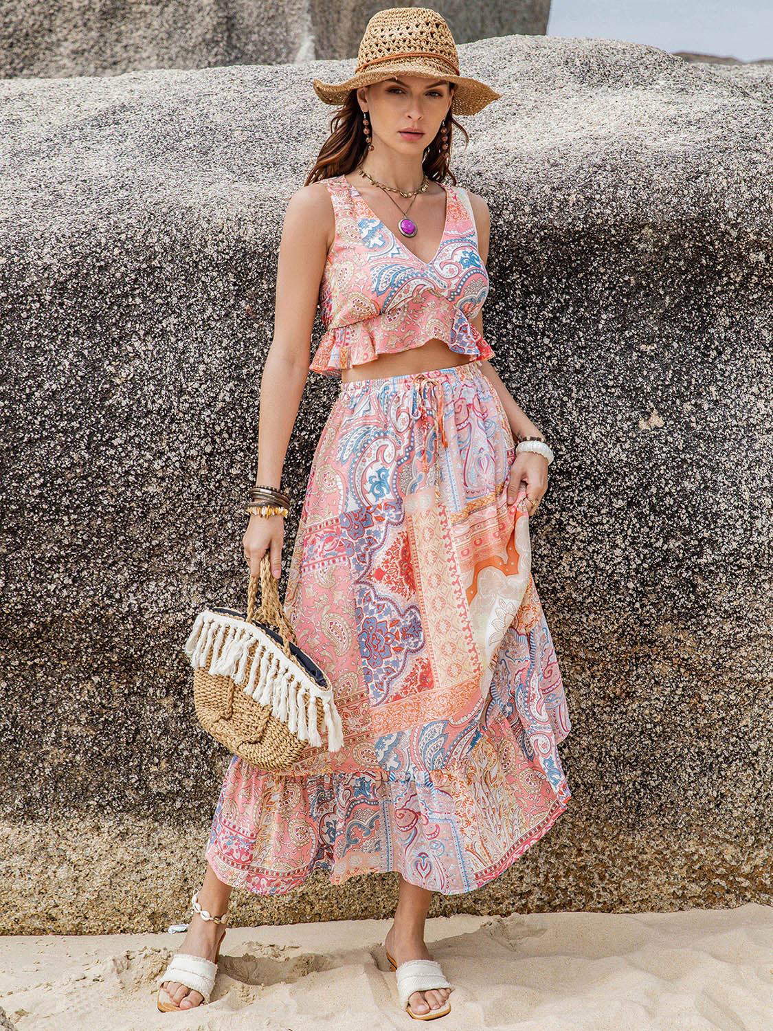 A stylish Printed V-Neck Top and Midi Skirt Set featuring a ruffled design, made from 100% viscose, displayed on a mannequin.