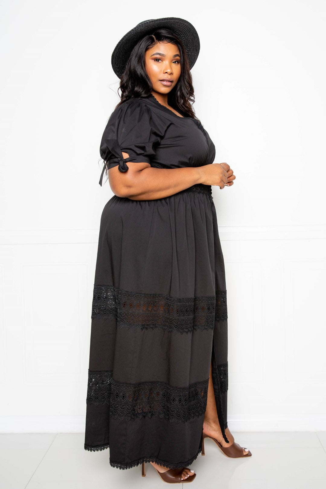 Puff Sleeve Maxi Dress featuring a lace insert, showcasing elegant puff sleeves and a flowing silhouette in black.