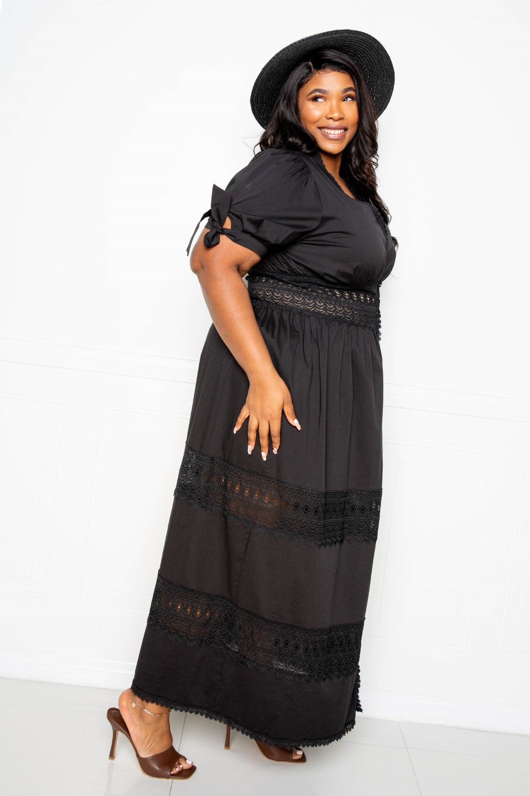 Puff Sleeve Maxi Dress featuring a lace insert, showcasing elegant puff sleeves and a flowing silhouette in black.