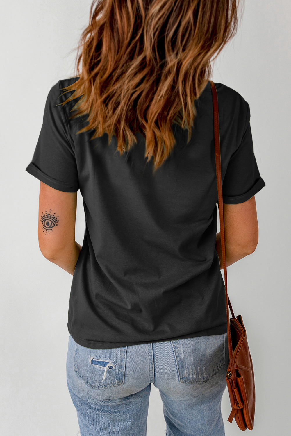 A stylish Pumpkin Graphic Cuffed Tee featuring a chic pumpkin design, round neck, and short sleeves, perfect for casual fall wear.