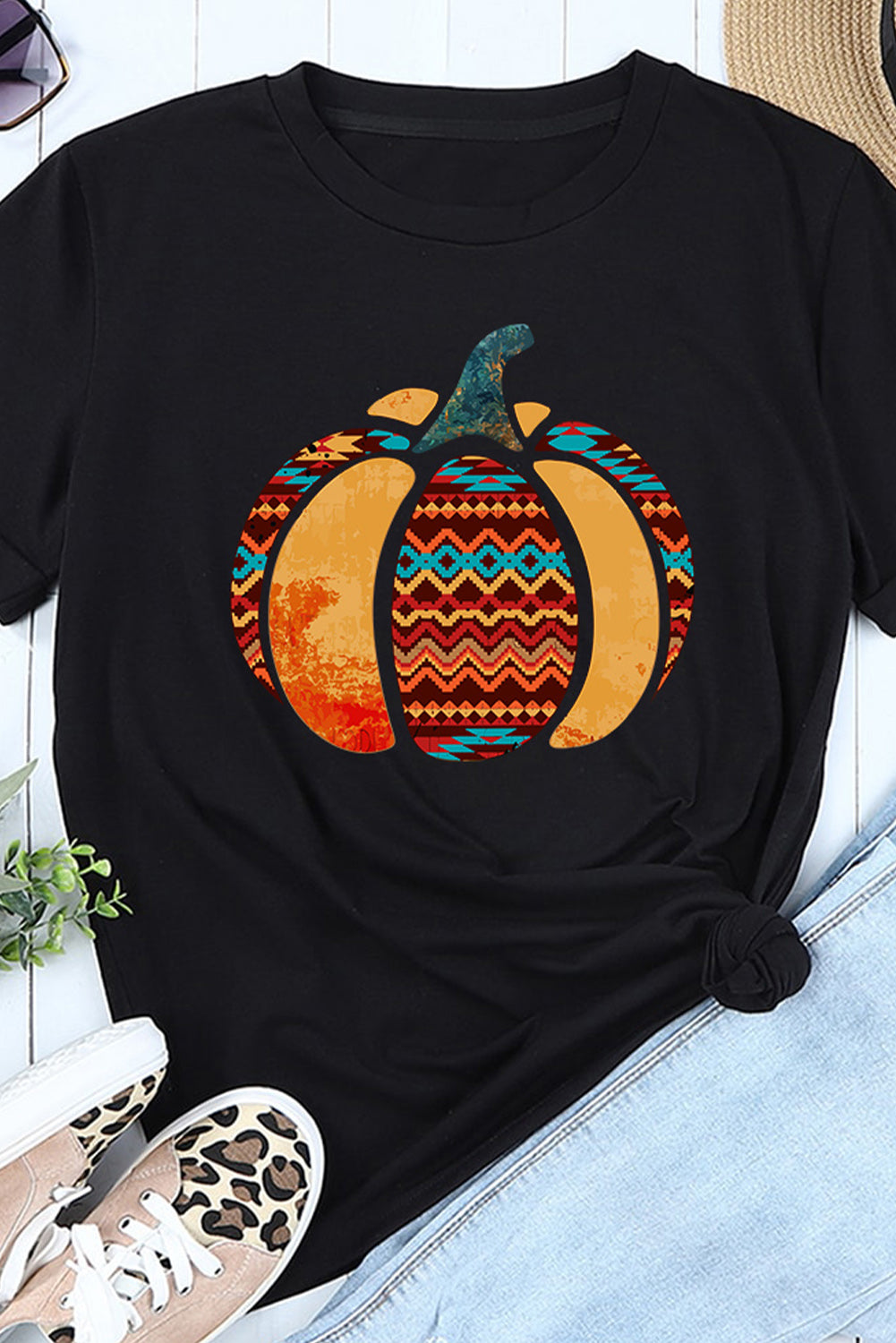 A stylish Pumpkin Graphic Cuffed Tee featuring a chic pumpkin design, round neck, and short sleeves, perfect for casual fall wear.