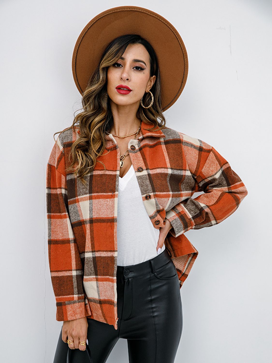 Pumpkin Spice Button-Down Jacket featuring a chic plaid design, collared neck, and long sleeves, perfect for fall fashion.