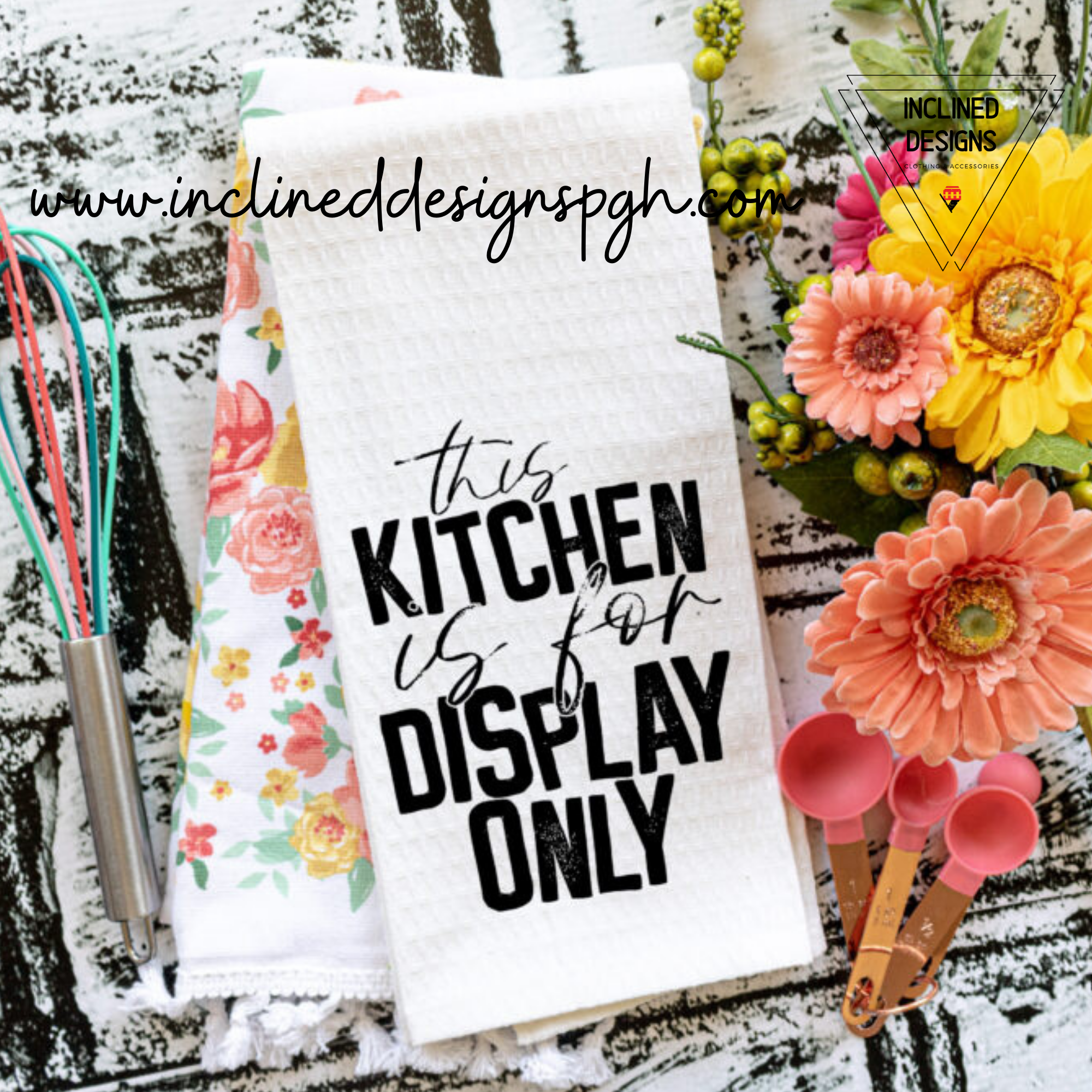 A collection of colorful Punny Tea Towels featuring humorous sayings, made from 100% cotton, displayed in a bright kitchen setting.