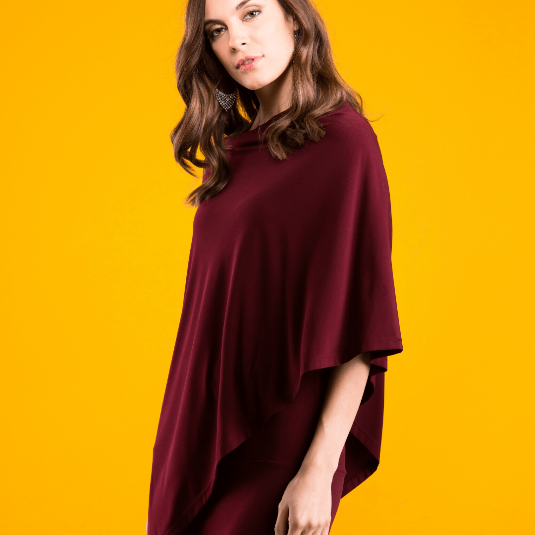 A stylish Pure Poncho in soft stretch knit fabric, showcasing its versatile design and seam detail.