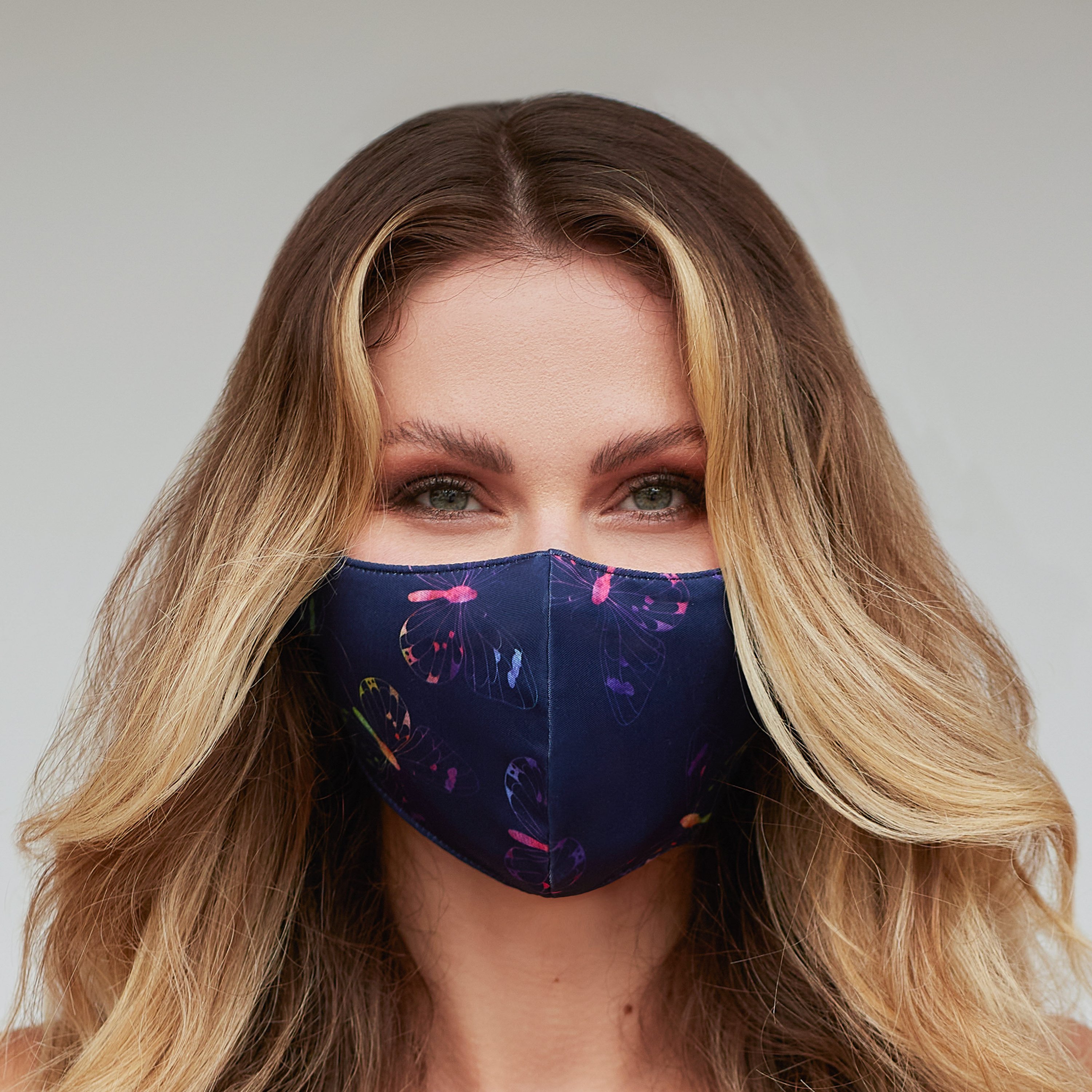 Purple Multi-Color Butterfly Face Mask featuring a vibrant butterfly design, made of breathable cotton and polyester layers.