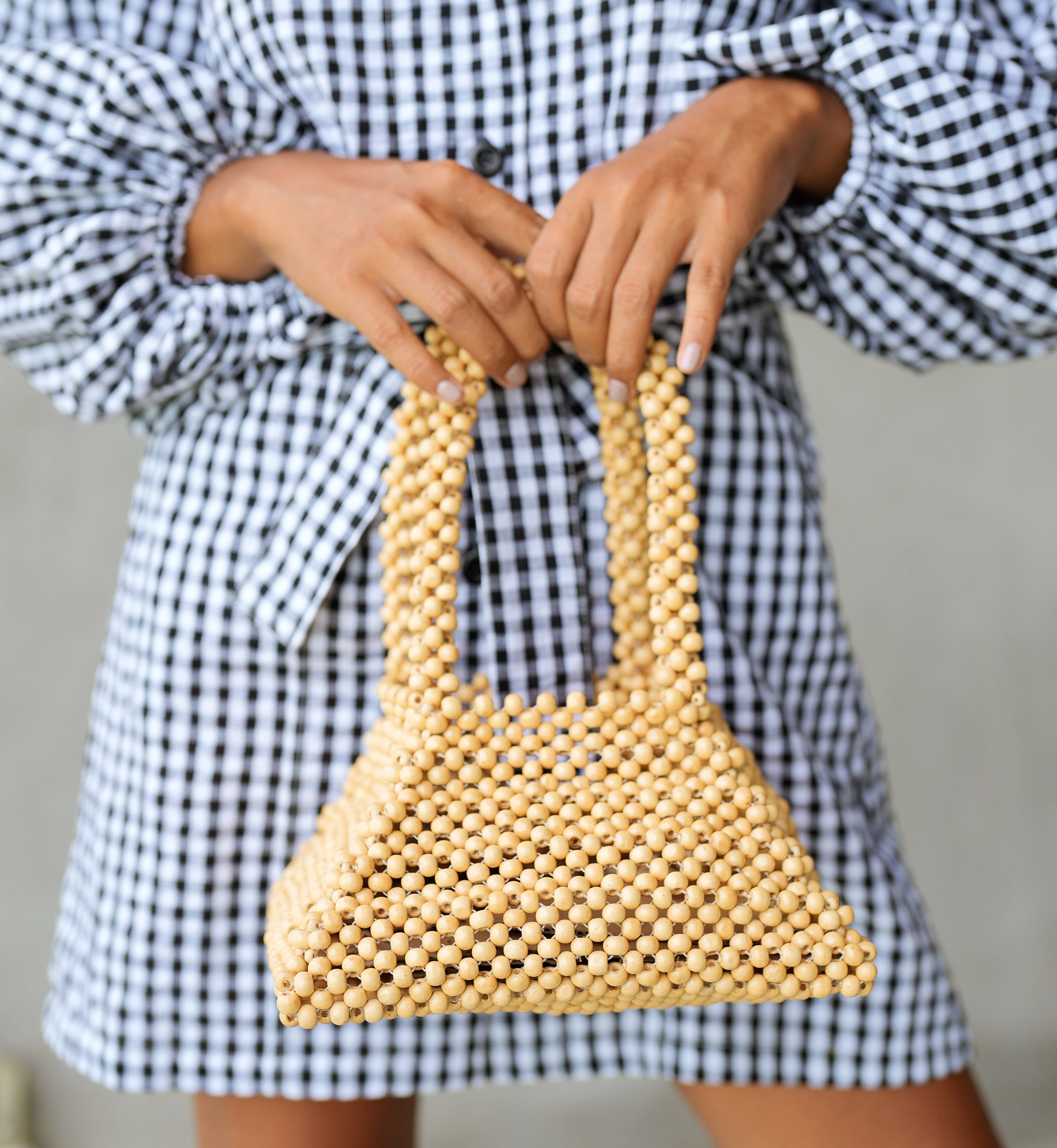 Pyramid Beaded Tote Bag in Toasted Beige featuring natural wooden beads and sturdy handles.