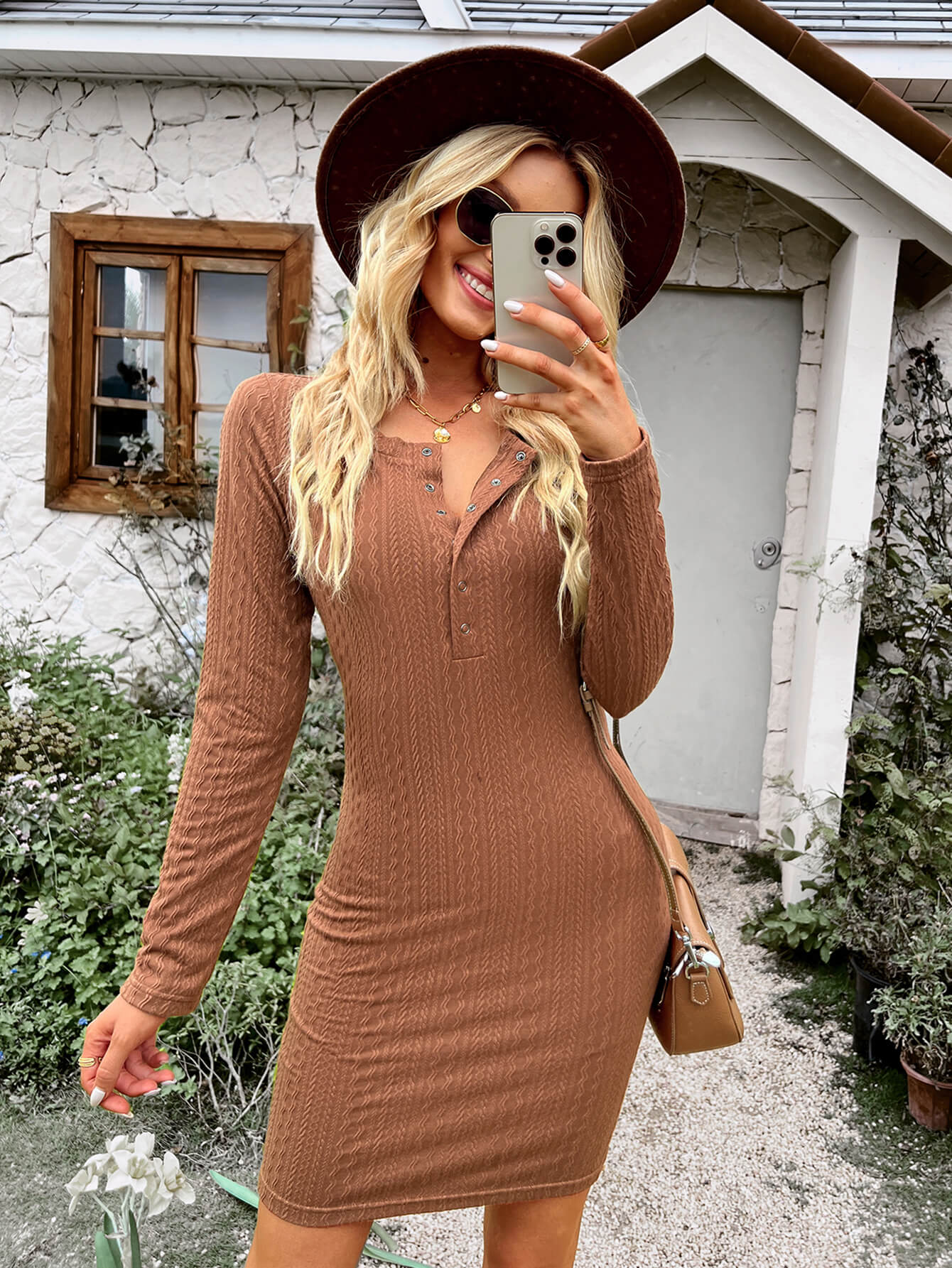 A stylish Quarter Snap Long Sleeve Textured Dress in a solid color, featuring a round neckline and long sleeves, perfect for casual outdoor events.