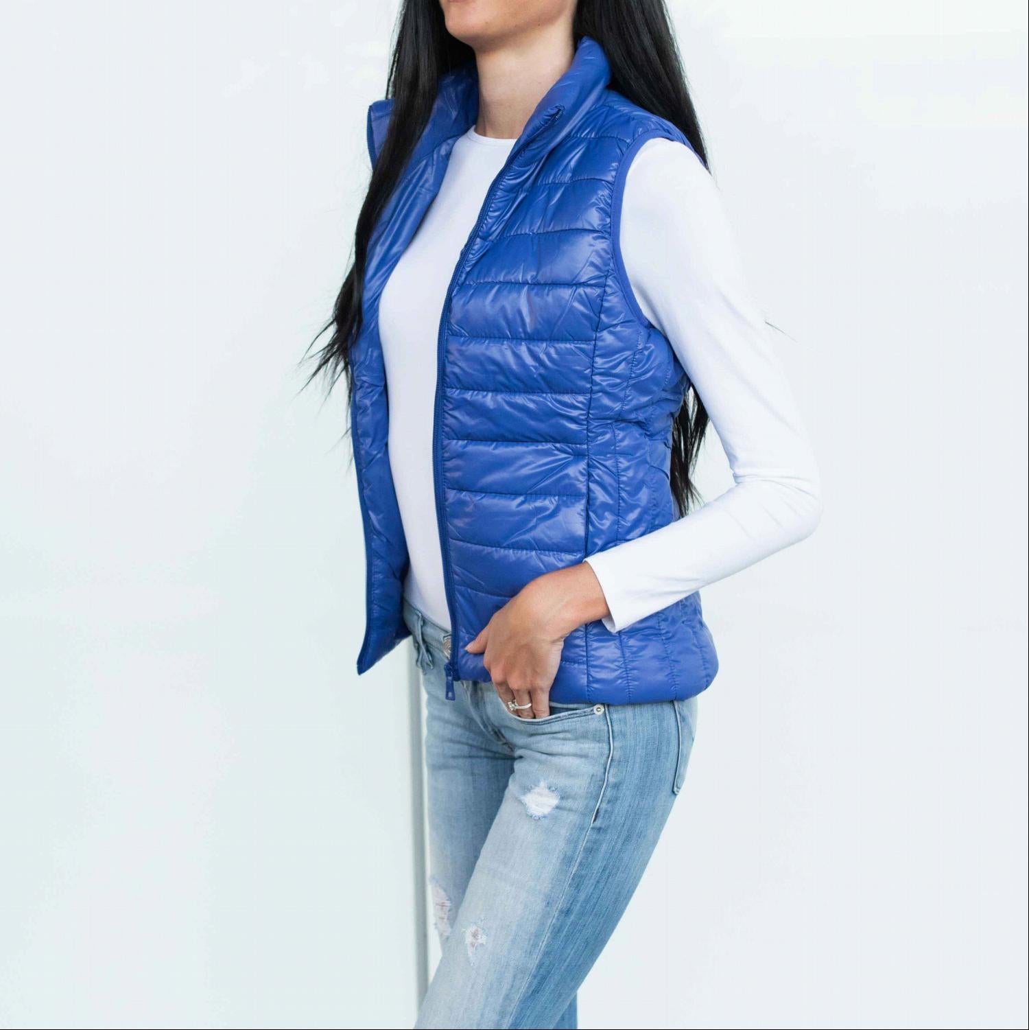 Chic quilted padded vest in shiny metallic finish, perfect for fall layering.