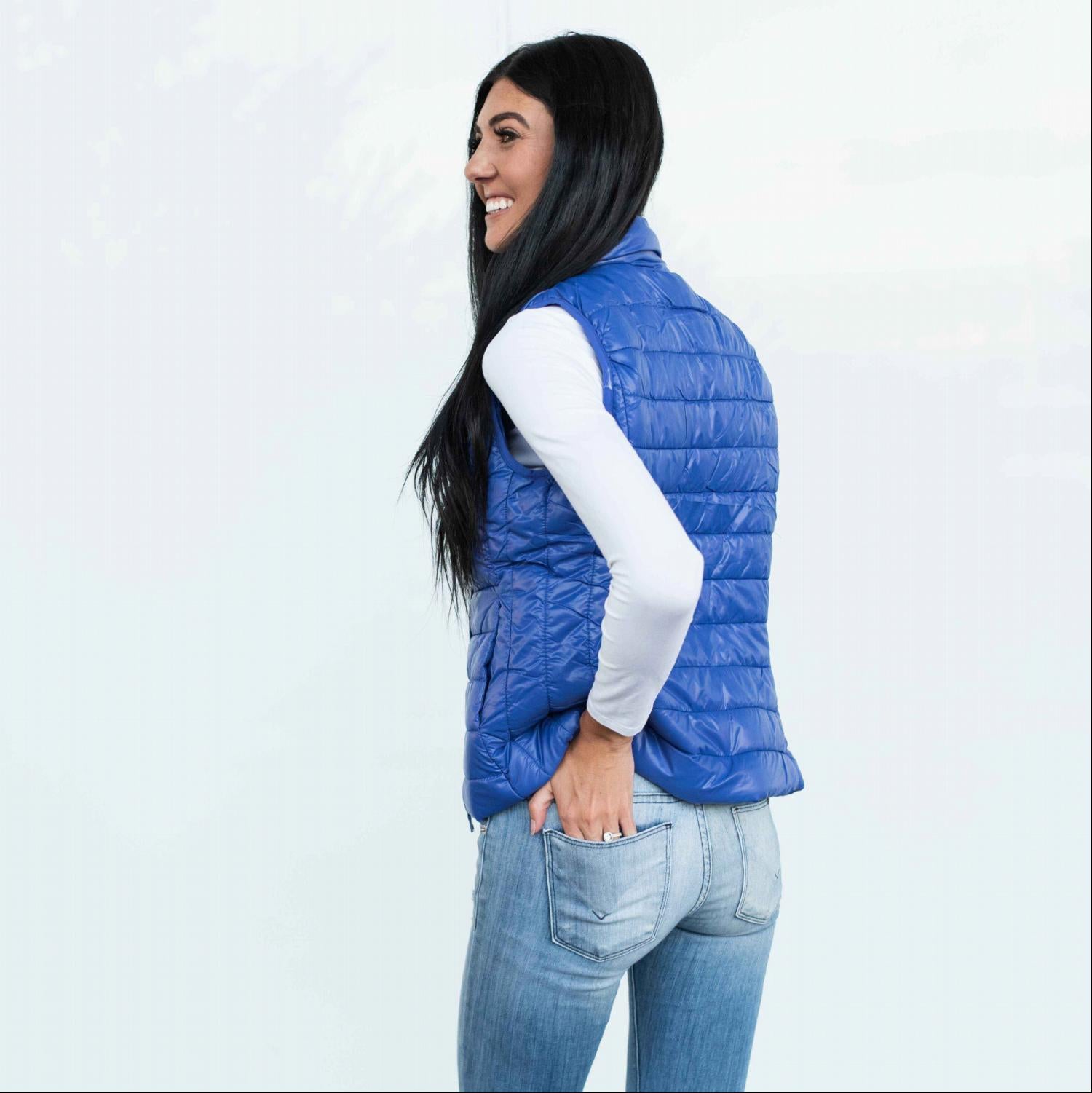 Chic quilted padded vest in shiny metallic finish, perfect for fall layering.