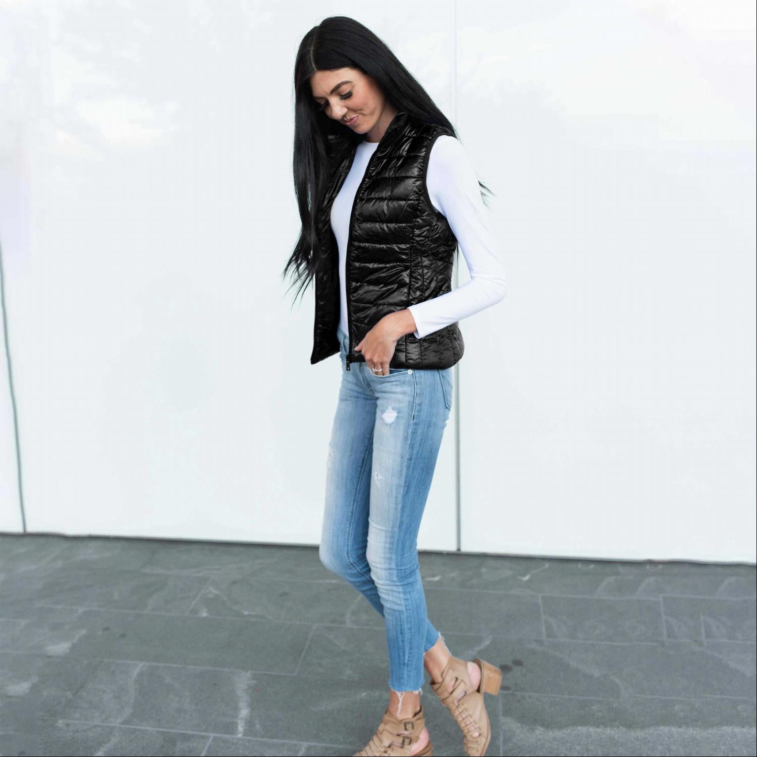 Chic quilted padded vest in shiny metallic finish, perfect for fall layering.